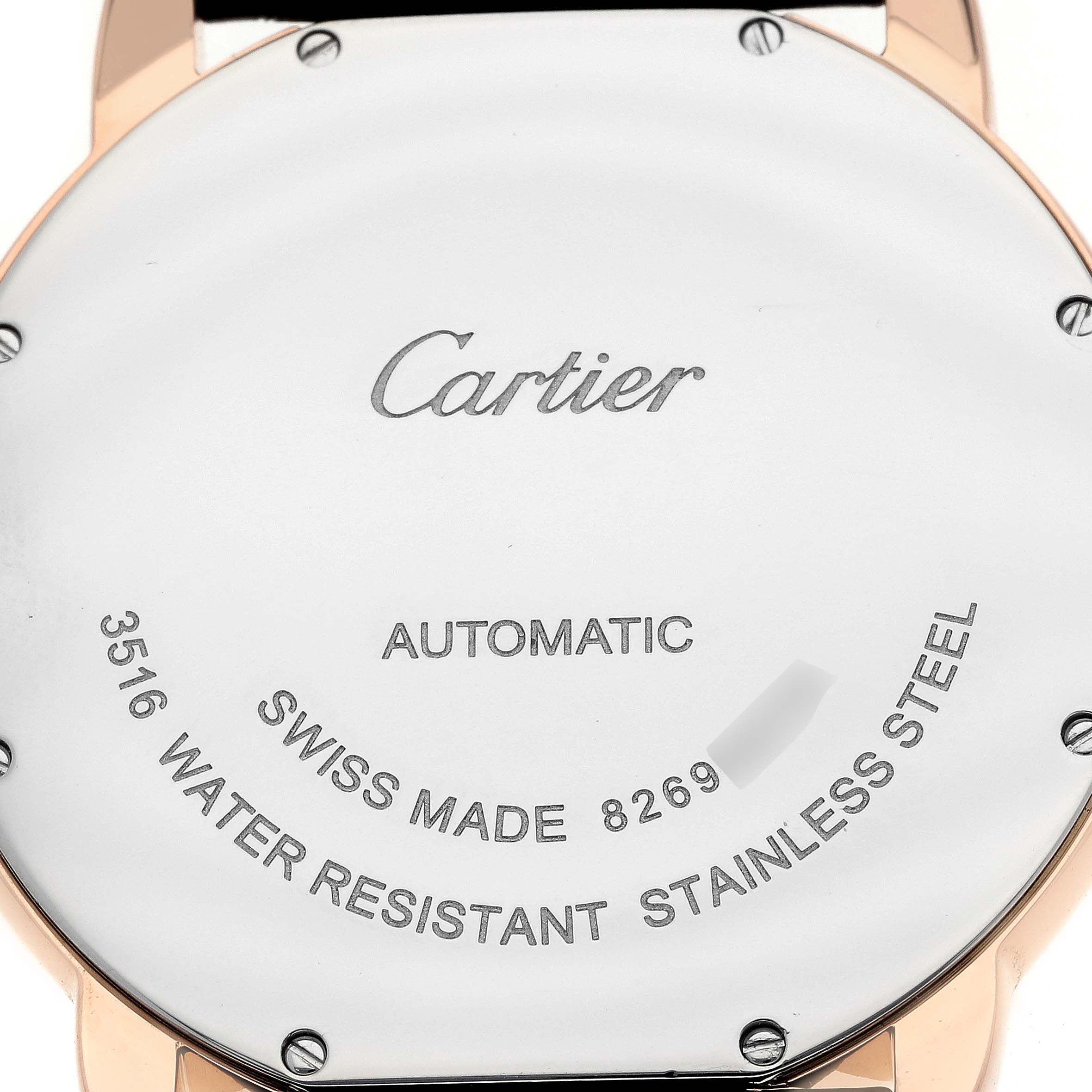 The image shows the back case of the Cartier Ronde W6701009 Men
s Steel and Gold (two tone) Silver Dial watch, featuring branding and specifications like "Automatic" and "Water Resistant."