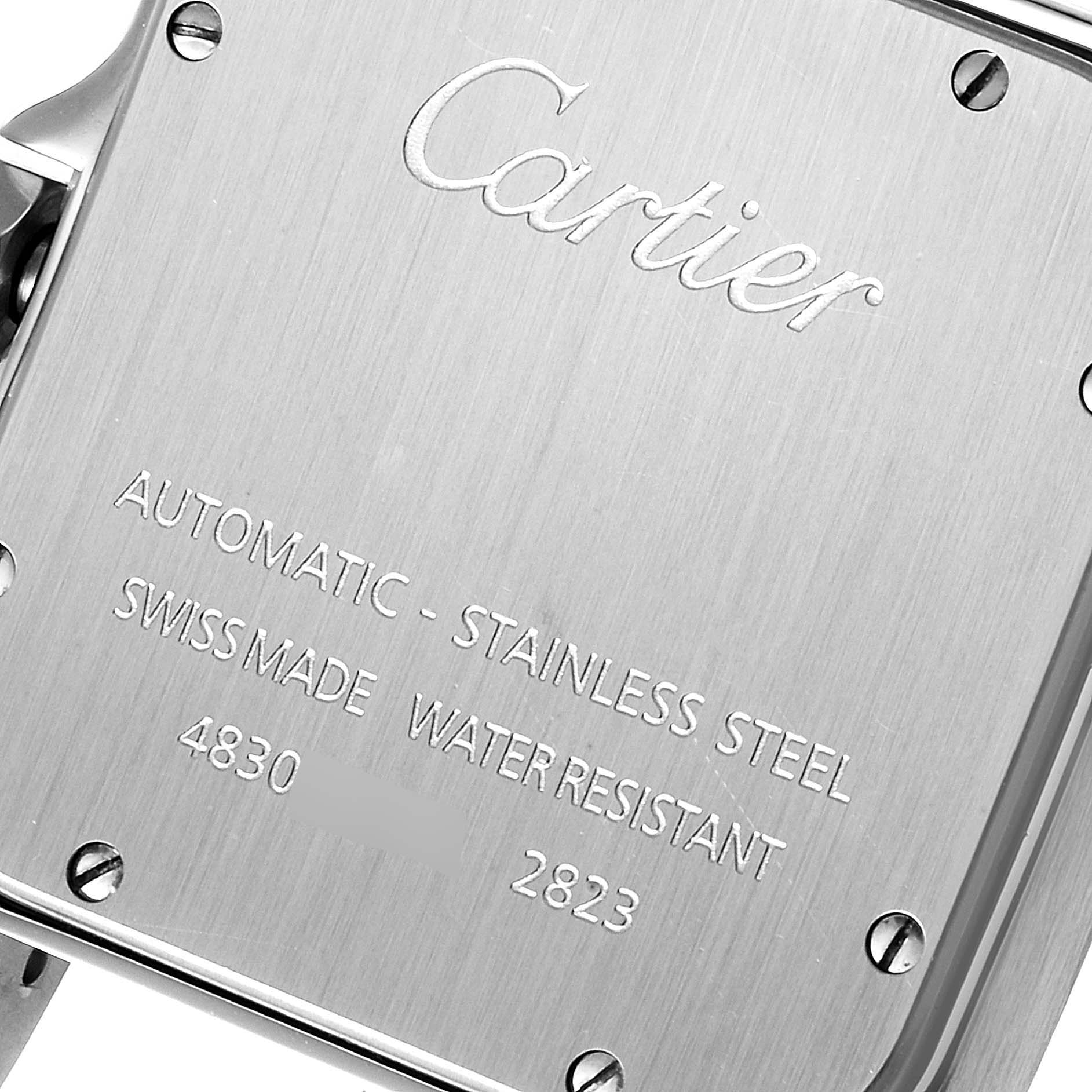 The image shows the case back of a Santos model watch by Cartier, displaying branding and specifications.