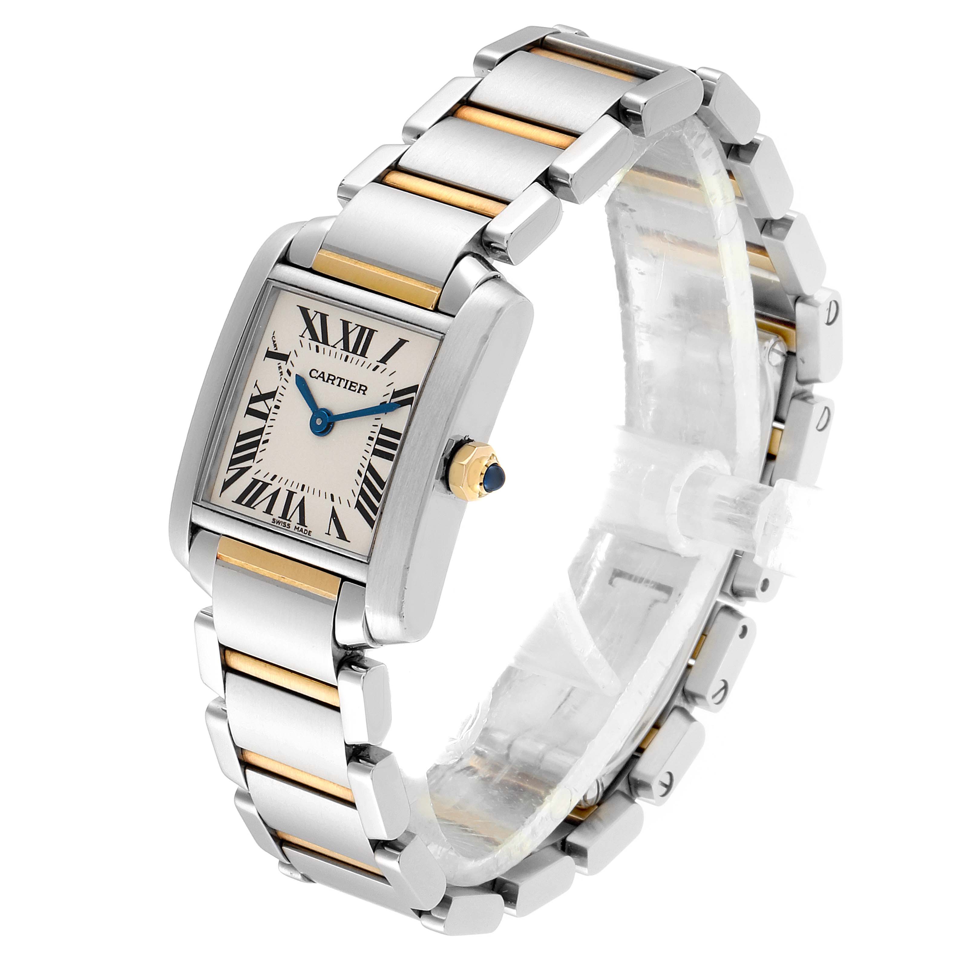 The image shows a Cartier Tank Française watch at an oblique angle, highlighting its face and bracelet with gold accents.