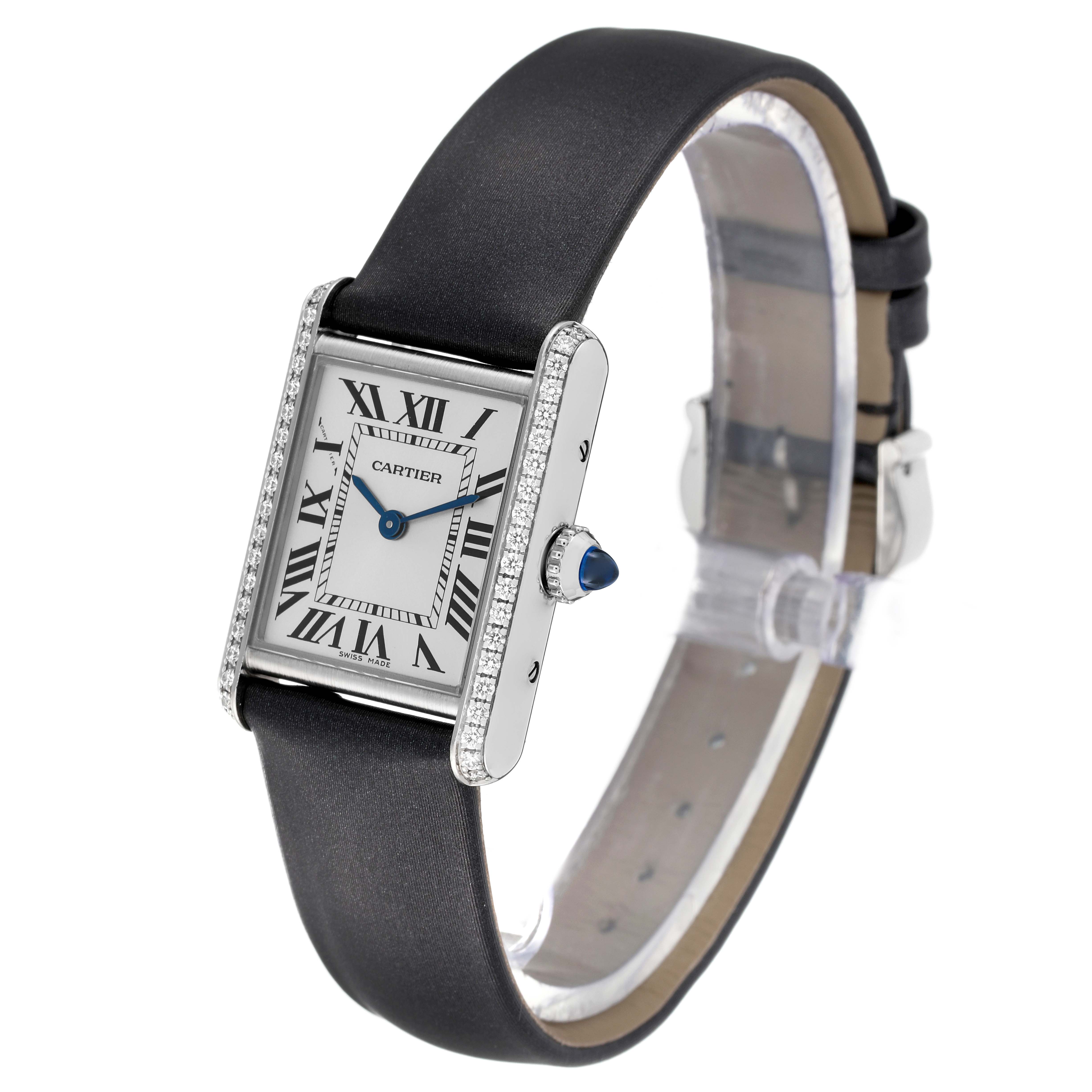 The image shows a Tank Must watch by Cartier from an angled side view, highlighting the dial, bezel, case, and leather strap.