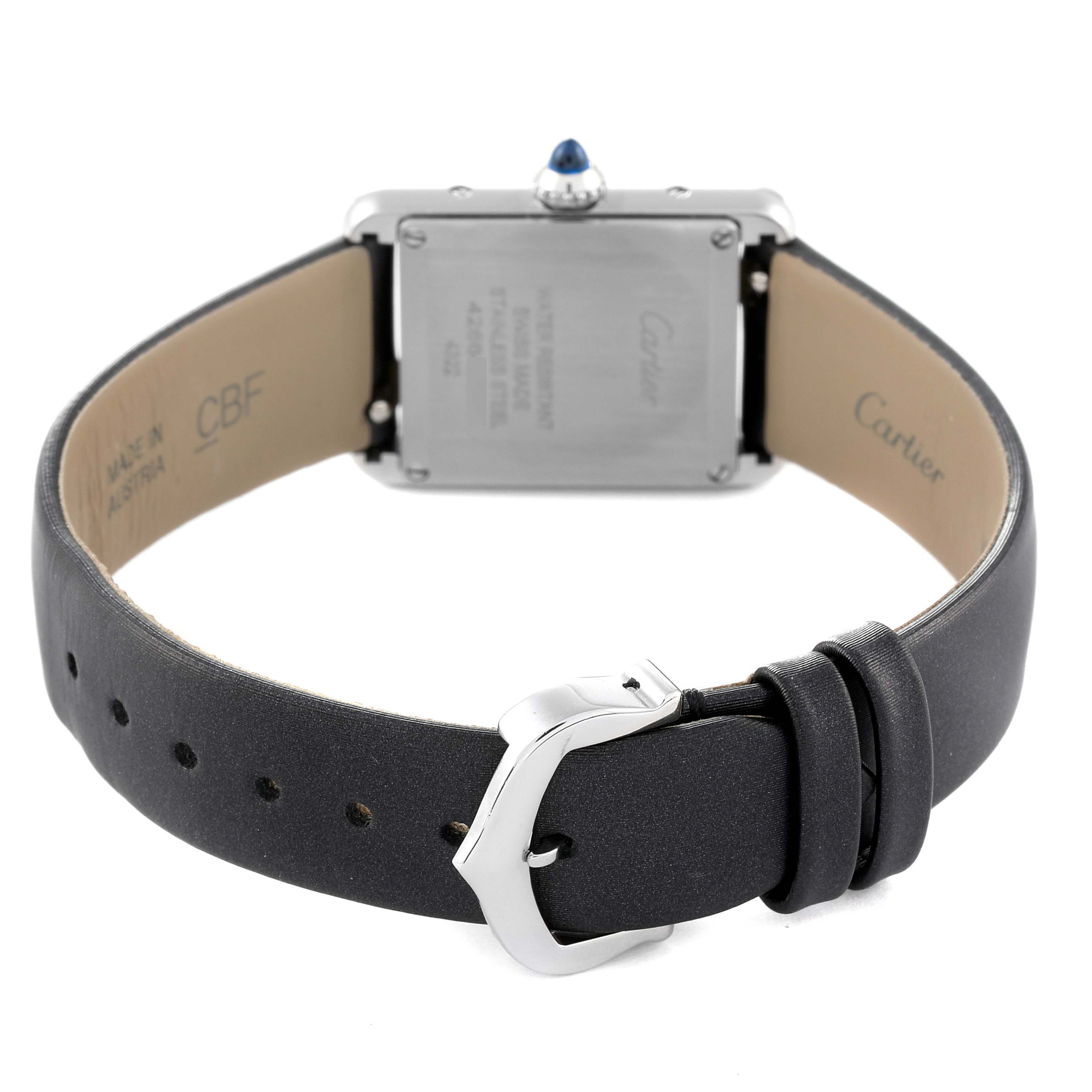 The image shows the back view of a Cartier Tank Must W4TA0016 Women's Stainless Steel Silver Dial W4TA0016 Women's Stainless Steel Silver Dial watch, highlighting the buckle, strap, and case back.
