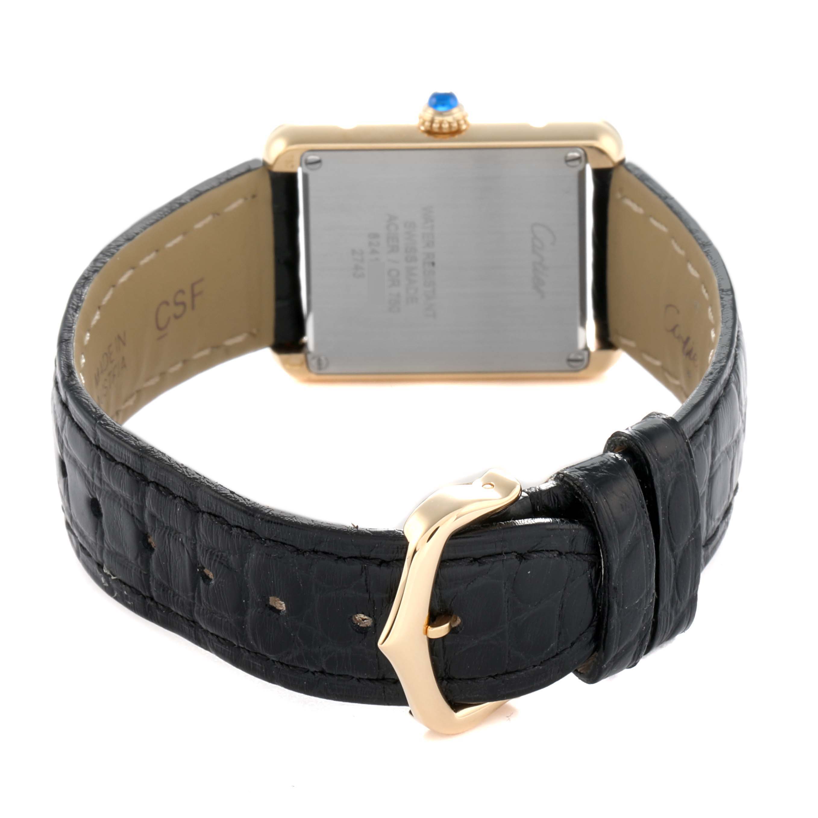 The image shows the back of a Cartier Tank Solo W1018755 Women
s Steel and Gold (two tone) Silver Dial watch, highlighting the leather strap and gold buckle.