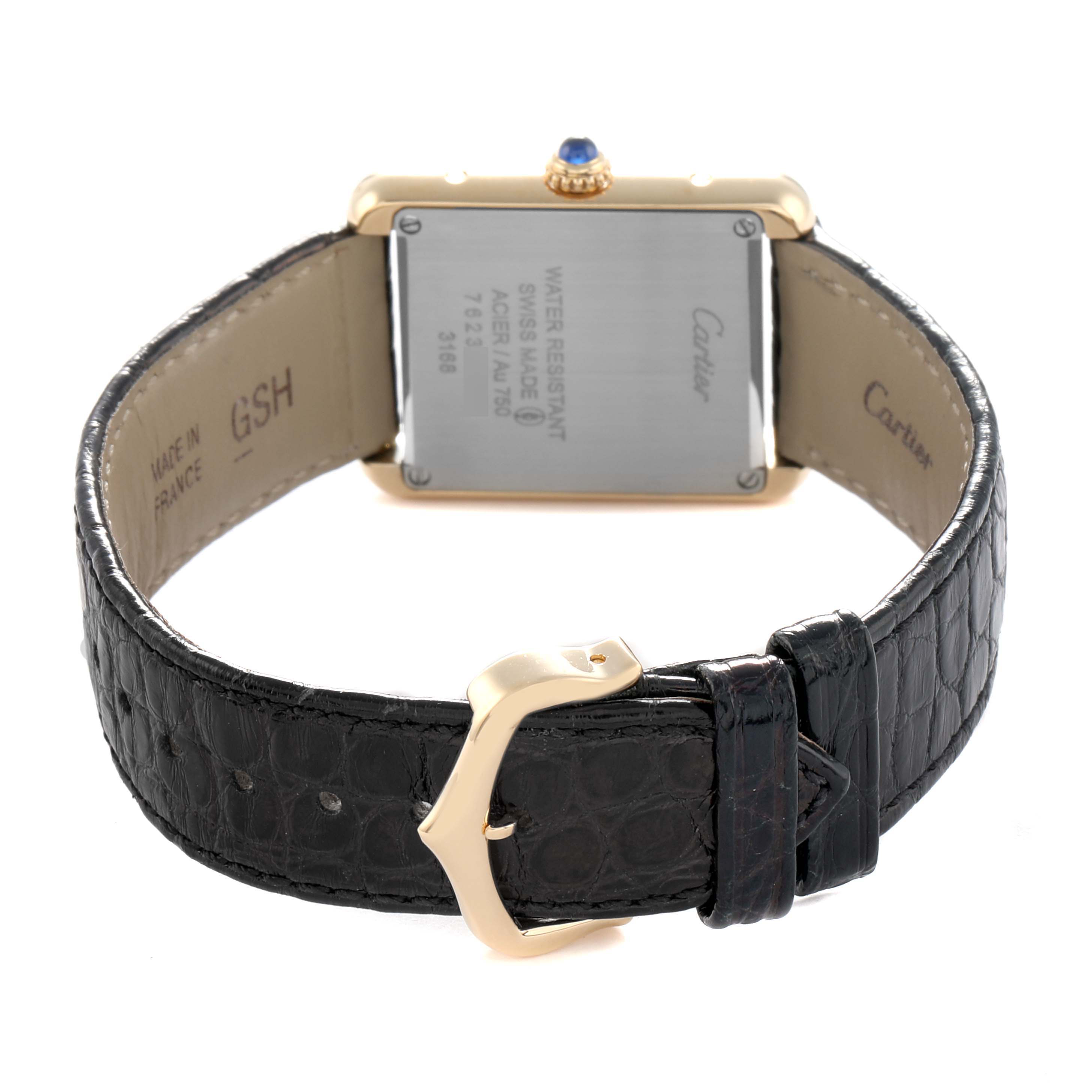 The image shows the back of a Cartier Tank Solo W5200002 Women
s Steel and Gold (two tone) Silver Dial watch, highlighting the case back, black leather strap, and buckle.