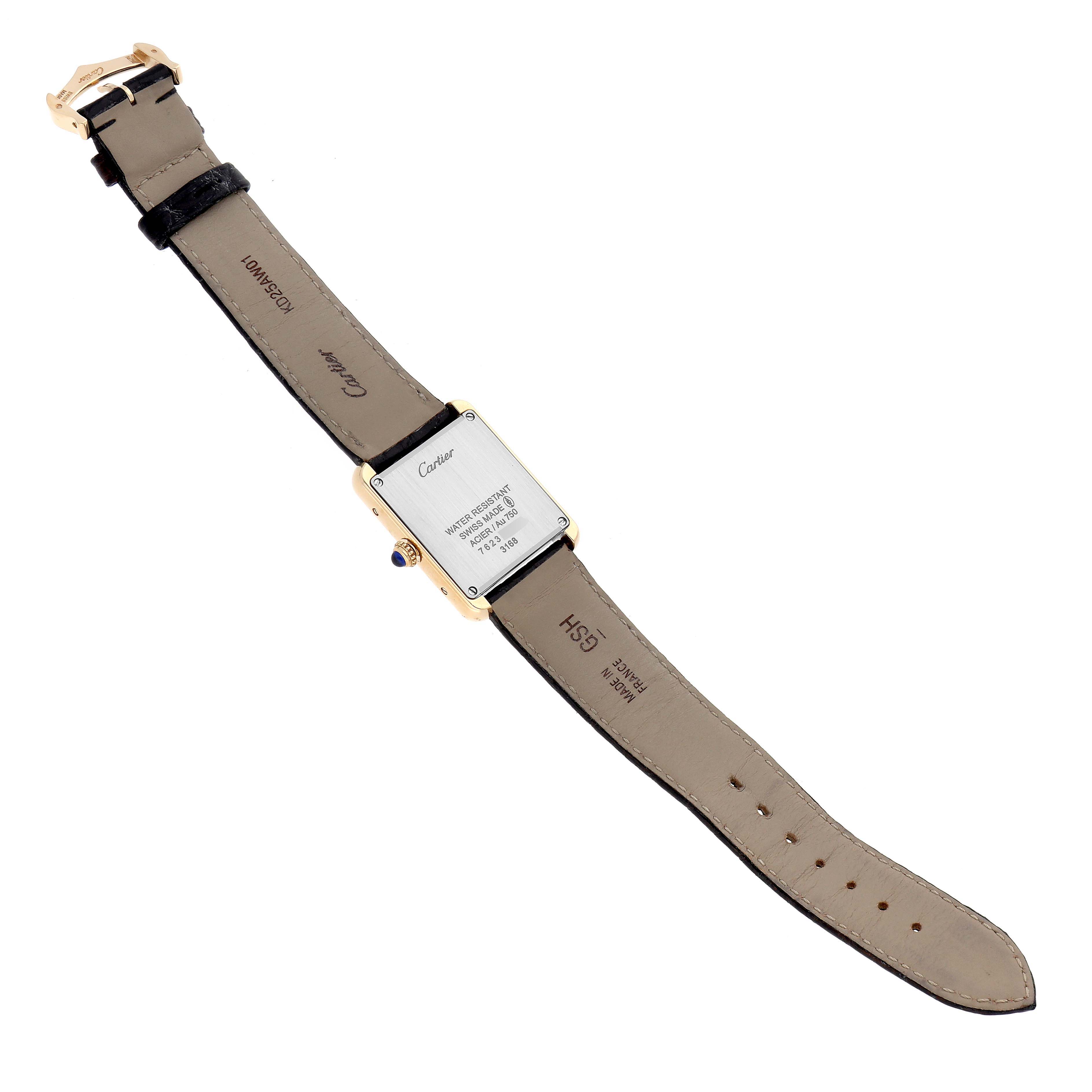 The image shows the back view of a Cartier Tank Solo W5200002 Women
s Steel and Gold (two tone) Silver Dial watch, highlighting the case back, straps, and buckle.