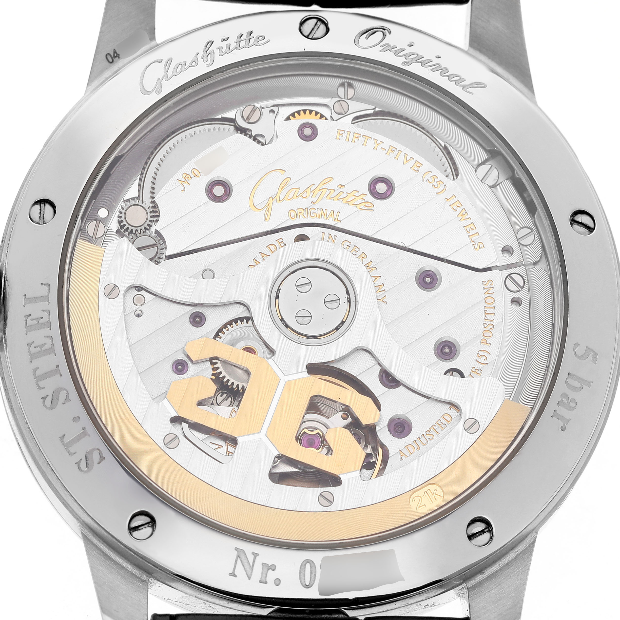 The Glashütte Original watch is shown from the back, revealing its intricate movement and rotor details.