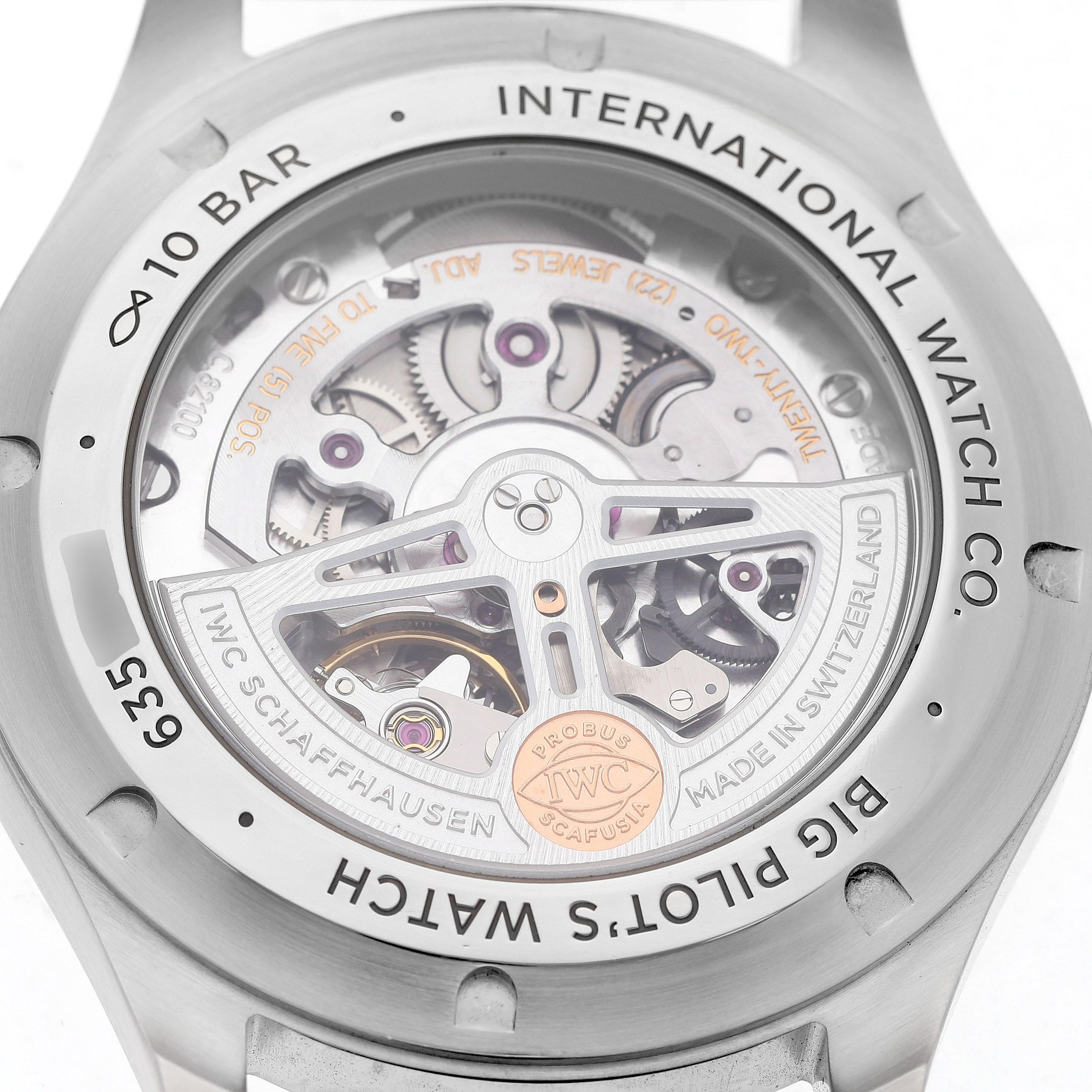 The image shows the back view of an IWC Pilot IW329306 Men's Stainless Steel Green Dial watch, highlighting its open case back and movement details.