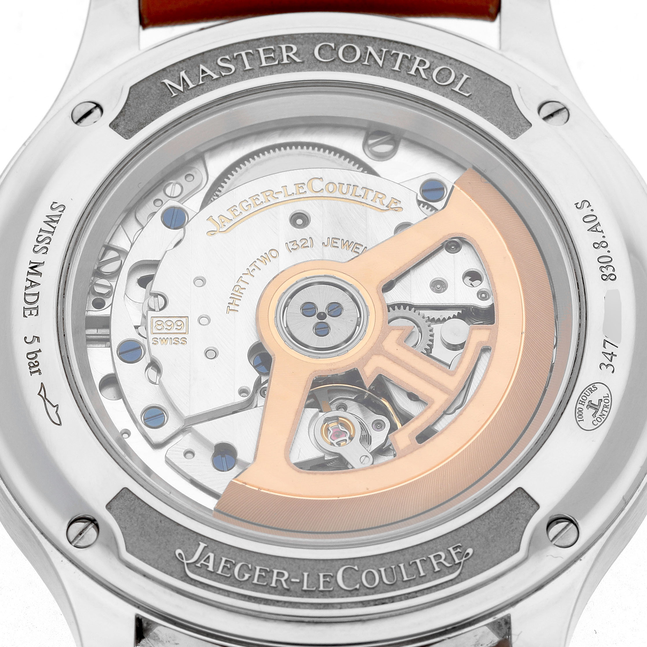 The image shows the back of a Jaeger-LeCoultre Master Control watch, displaying its intricate movement and rotor.