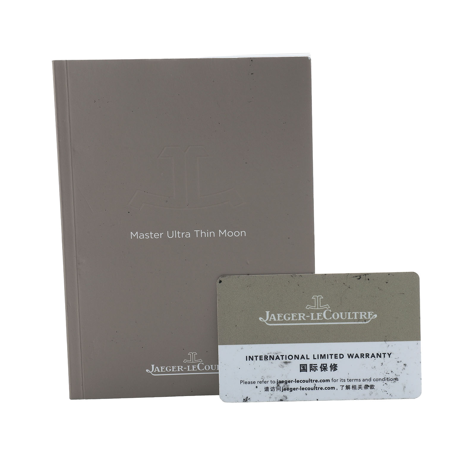 The image shows a Jaeger LeCoultre Master Q4018420 Men's Stainless Steel Silver Dial Ultra Thin Moon booklet and an International Limited Warranty card.