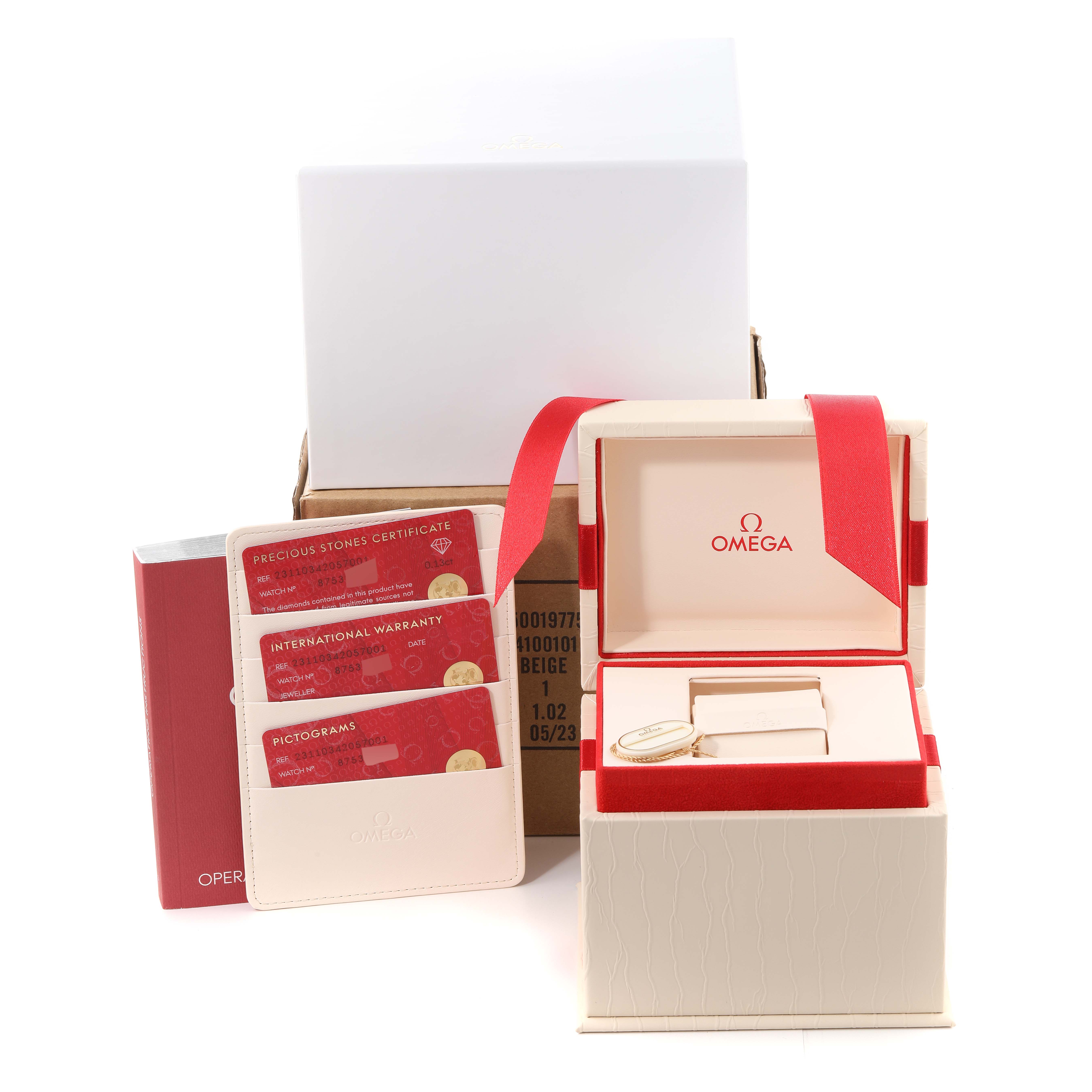 The image shows the packaging and accessories for the Omega 231.10.34.20.57.001 Women's Stainless Steel Mother of Pearl Dial 231.10.34.20.57.001 Women's Stainless Steel Mother of Pearl Dial Aqua Terra 34 Mother Of Pearl Diamond Ladies Watch 231.10.34.20.57.001, including the box, warranty cards, and tags.