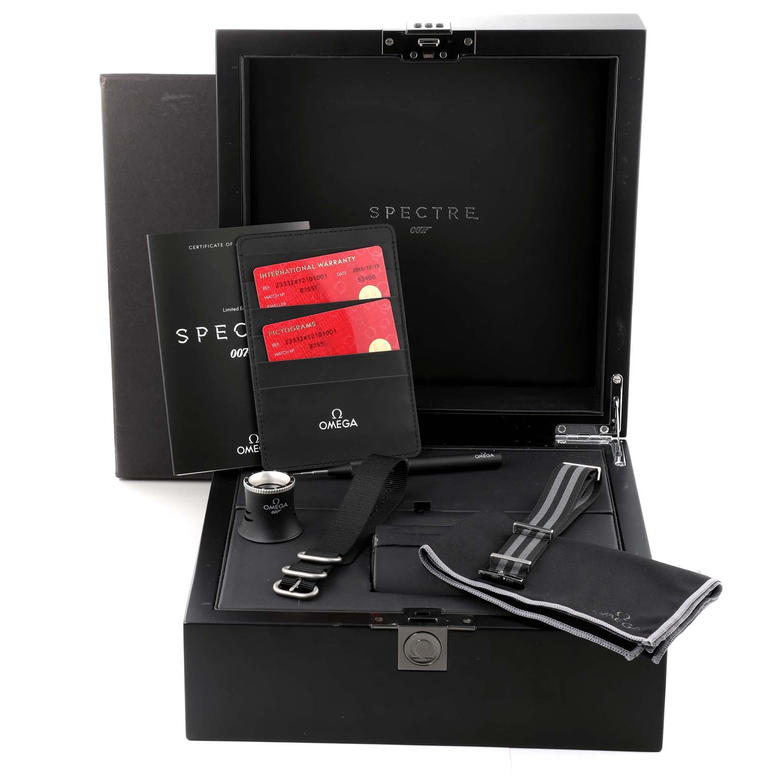 The image shows the accessories and packaging for an Omega Seamaster 233.32.41.21.01.001 Men's Stainless Steel Black Dial 233.32.41.21.01.001 Men's Stainless Steel Black Dial model, including warranty cards, a strap, and an instruction booklet.