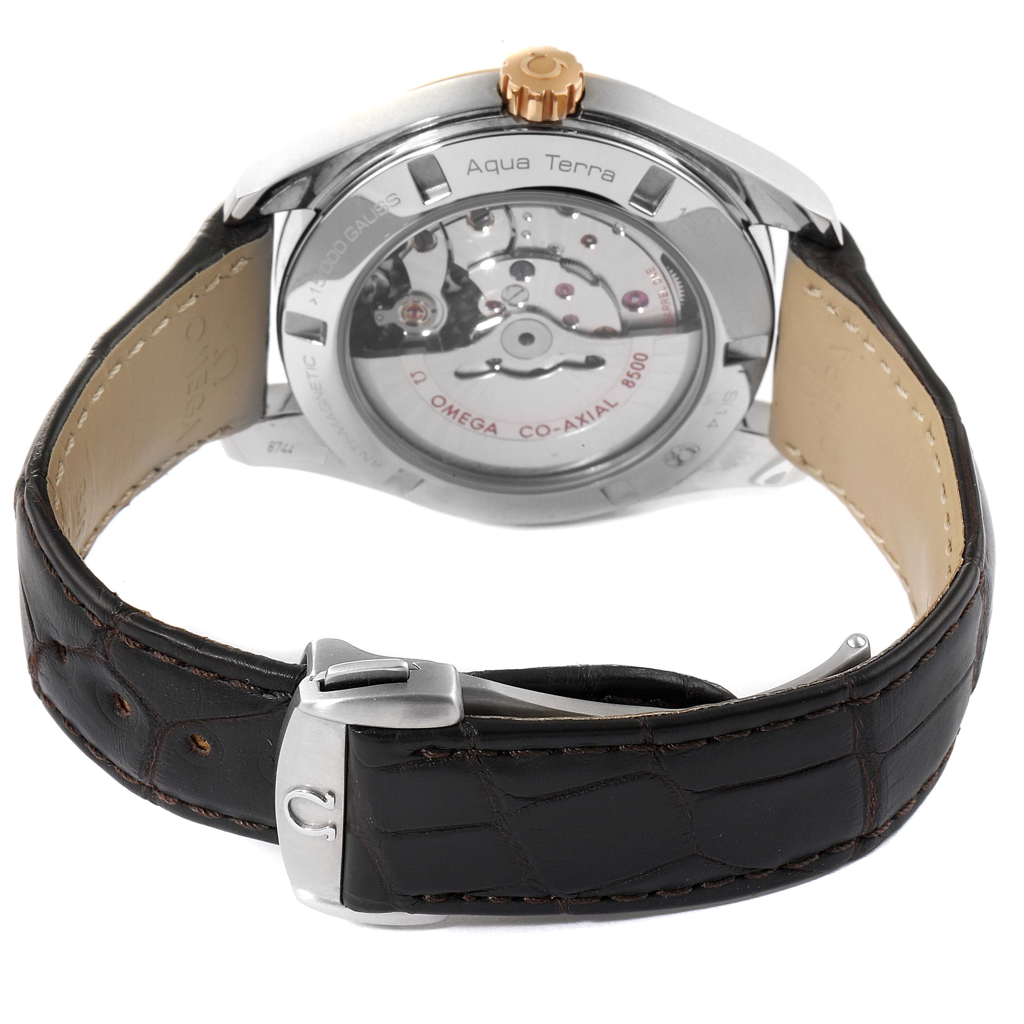 The image shows the back view of the Omega Aqua Terra 231.23.42.21.02.001 Men's Steel and Gold (two tone) Silver Dial 231.23.42.21.02.001 Men's Steel and Gold (two tone) Silver Dial watch, highlighting the movement and the leather strap with a clasp.