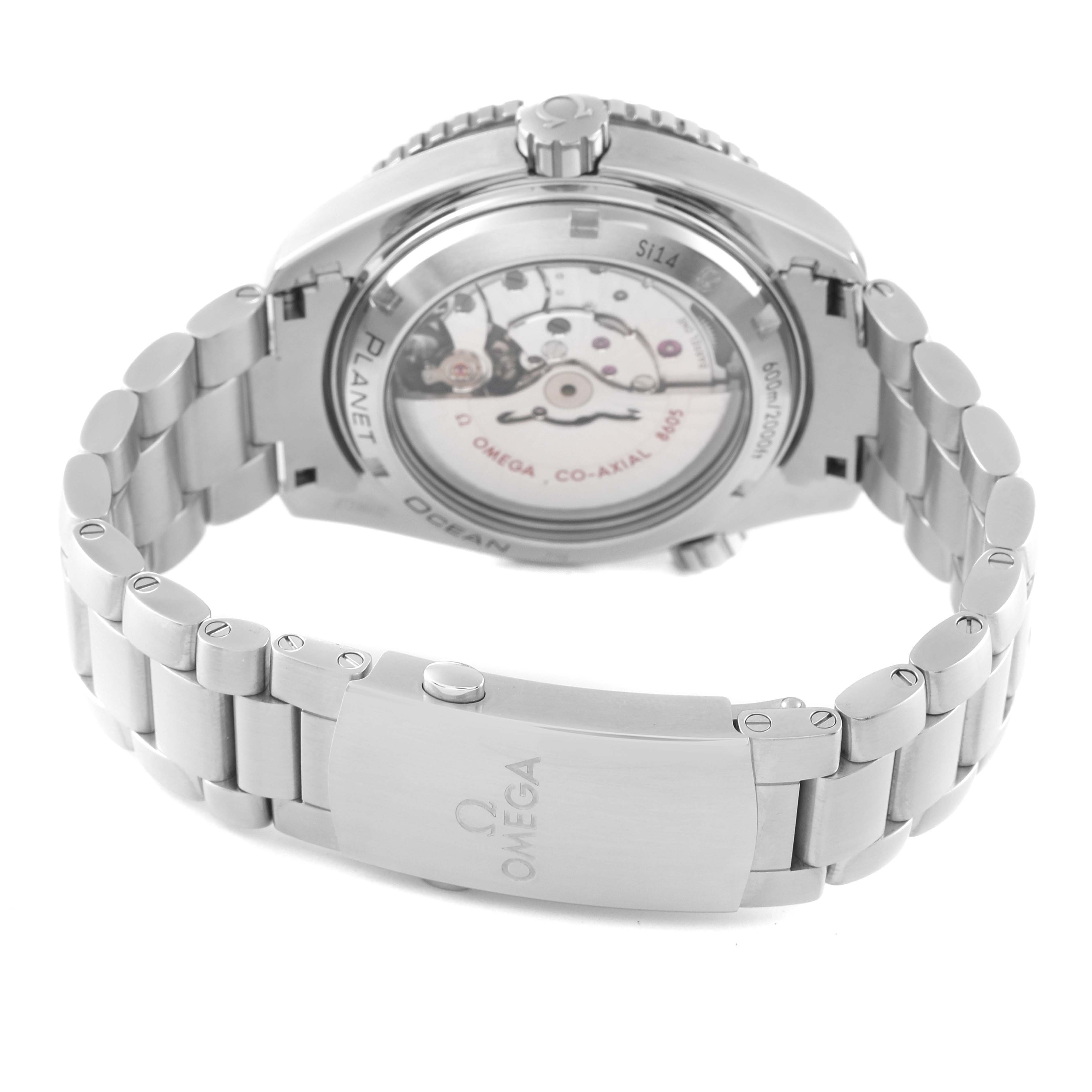 The image shows the back view of an Omega Planet Ocean 232.30.44.22.01.001 Men's Stainless Steel Black Dial 232.30.44.22.01.001 Men's Stainless Steel Black Dial watch, detailing the movement through the transparent case back and the metal bracelet.