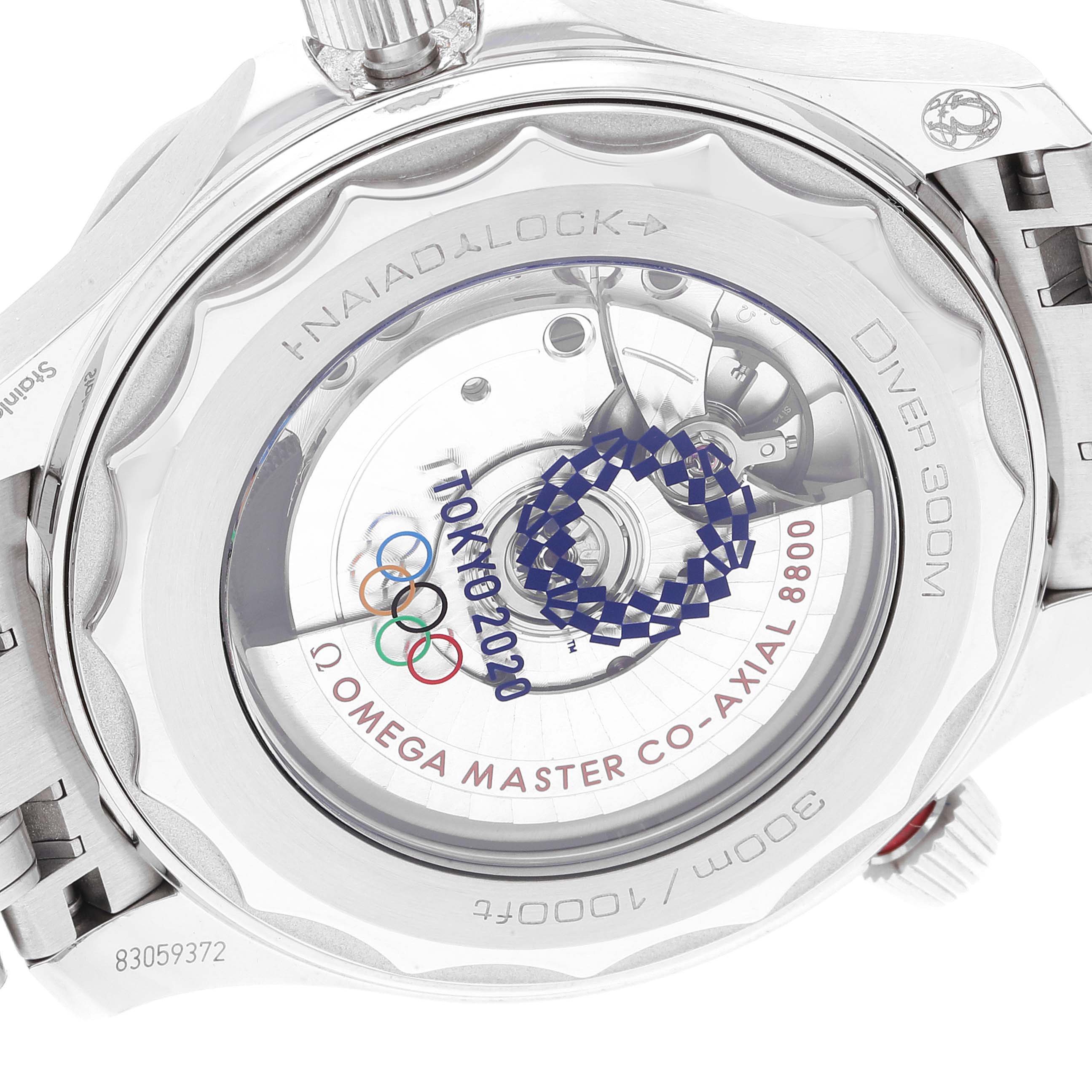 This image shows the back and movement of the Omega Seamaster 522.30.42.20.04.001 Men's Stainless Steel White Dial 522.30.42.20.04.001 Men's Stainless Steel White Dial, featuring the "Tokyo 2020" edition engraving and the Co-Axial 8800 mechanism.