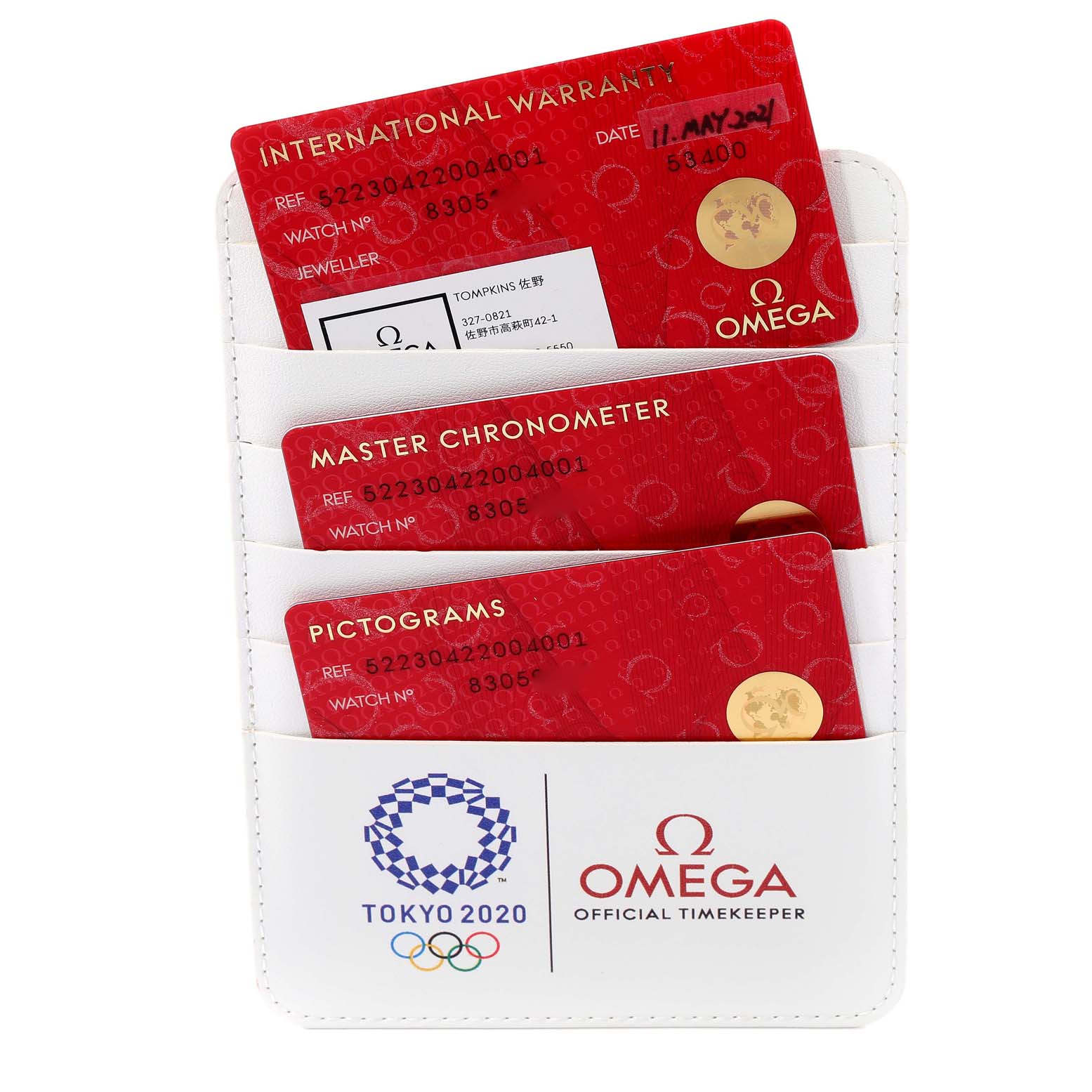 The image shows warranty cards and documentation for an Omega Seamaster 522.30.42.20.04.001 Men's Stainless Steel White Dial 522.30.42.20.04.001 Men's Stainless Steel White Dial watch, including International Warranty, Master Chronometer, and Pictograms cards.