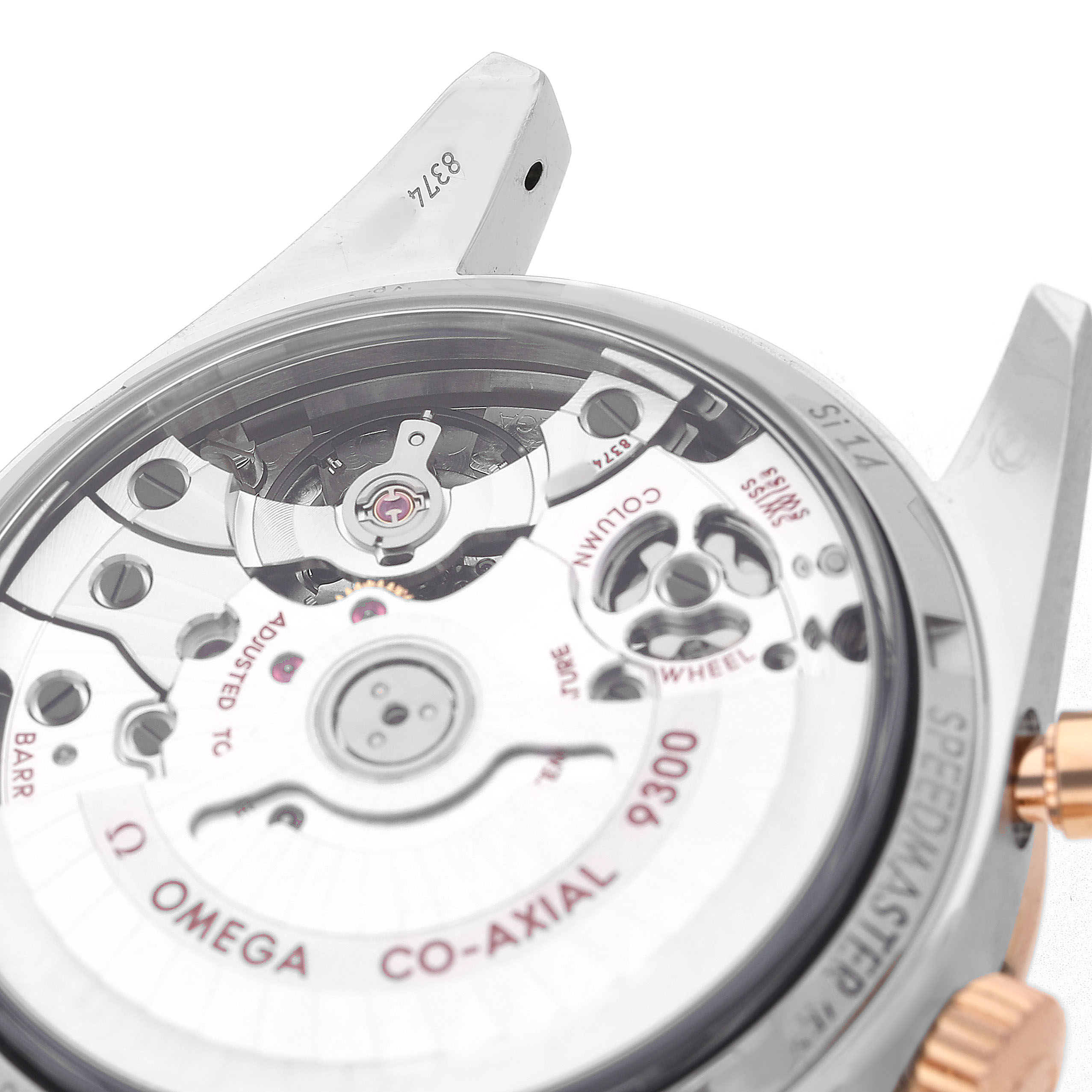 The image shows the case back of the Omega Speedmaster 331.20.42.51.01.002 Men's Rose Gold Black Dial with visible movement details from a tilted angle.