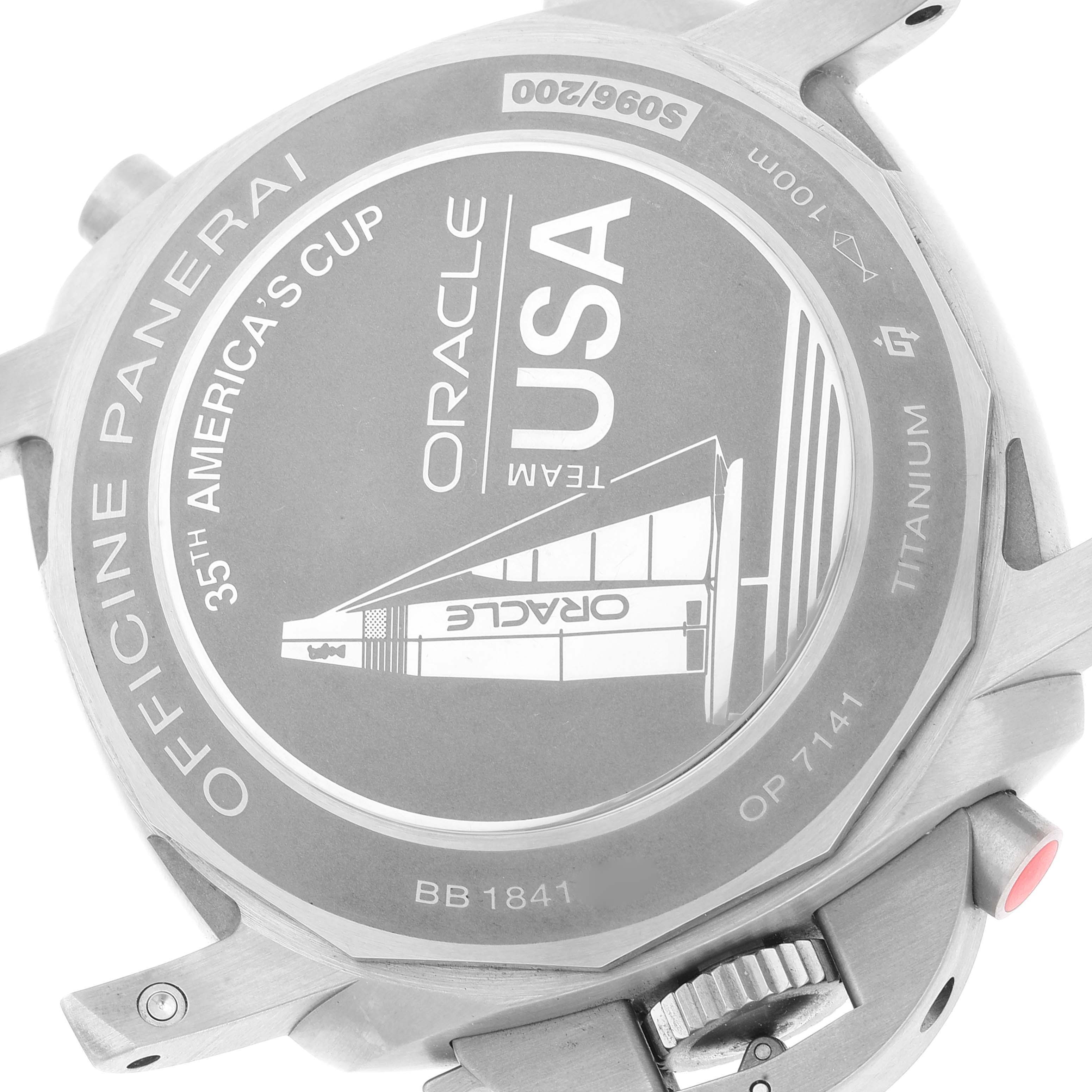 The image shows the back case of a Panerai Luminor PAM00726 Men's Titanium Black Dial PAM00726 Men's Titanium Black Dial watch, featuring an engraving for the 35th America's Cup, Team Oracle USA.