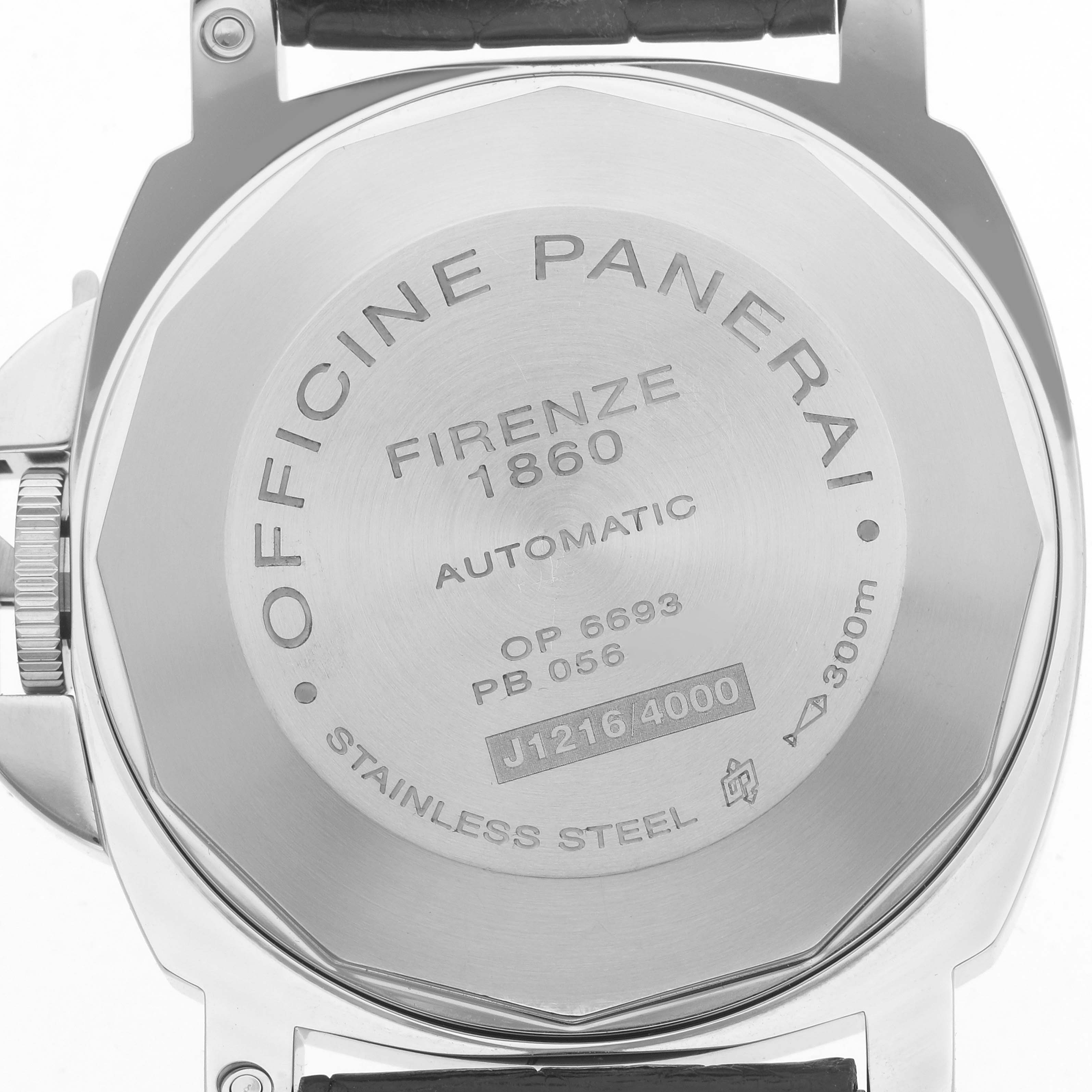 The image shows the case back of the Panerai Luminor PAM00104 Men
s Stainless Steel Black Dial watch, highlighting the engravings and stainless steel finish.