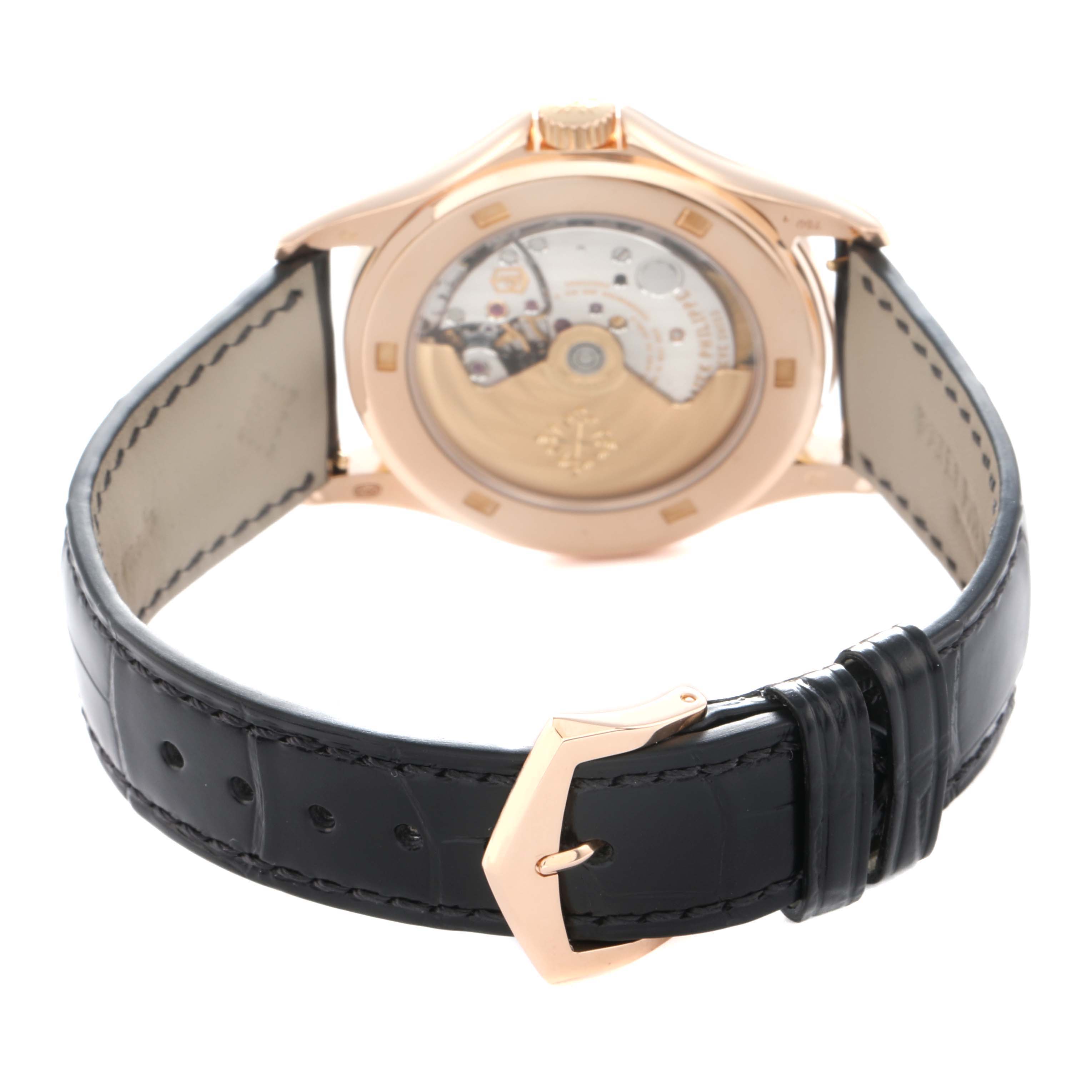 The image shows the case back and strap of a Patek Philippe Calatrava 5127R Men
s Rose Gold Silver Dial, highlighting its movement and clasp.