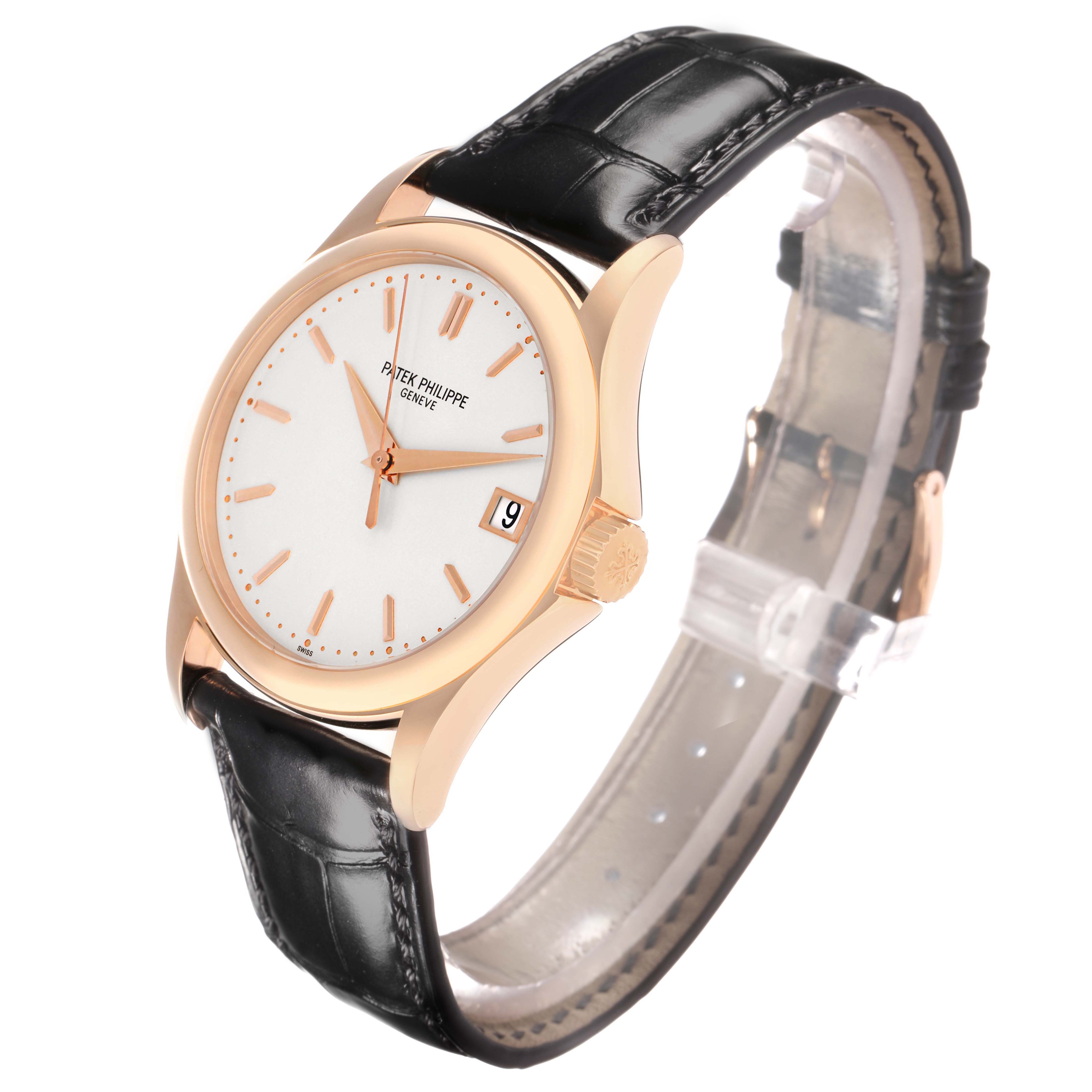 The image shows a Patek Philippe Calatrava 5127R Men
s Rose Gold Silver Dial watch from a three-quarter angle, highlighting the dial, case, crown, and leather strap.