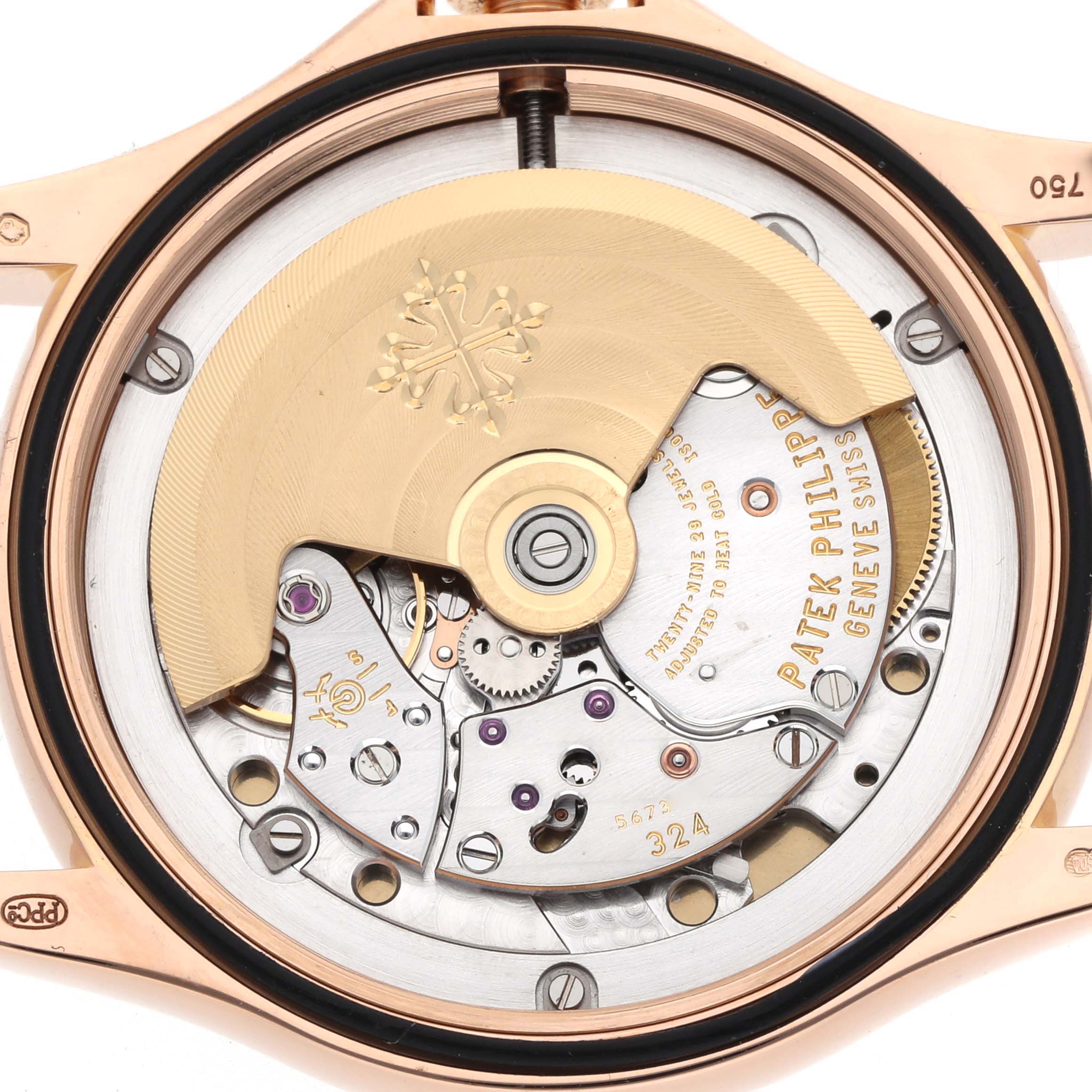 The image shows the back of a Patek Philippe Calatrava 5127R Men
s Rose Gold Silver Dial watch, highlighting its intricate movement and rotor.