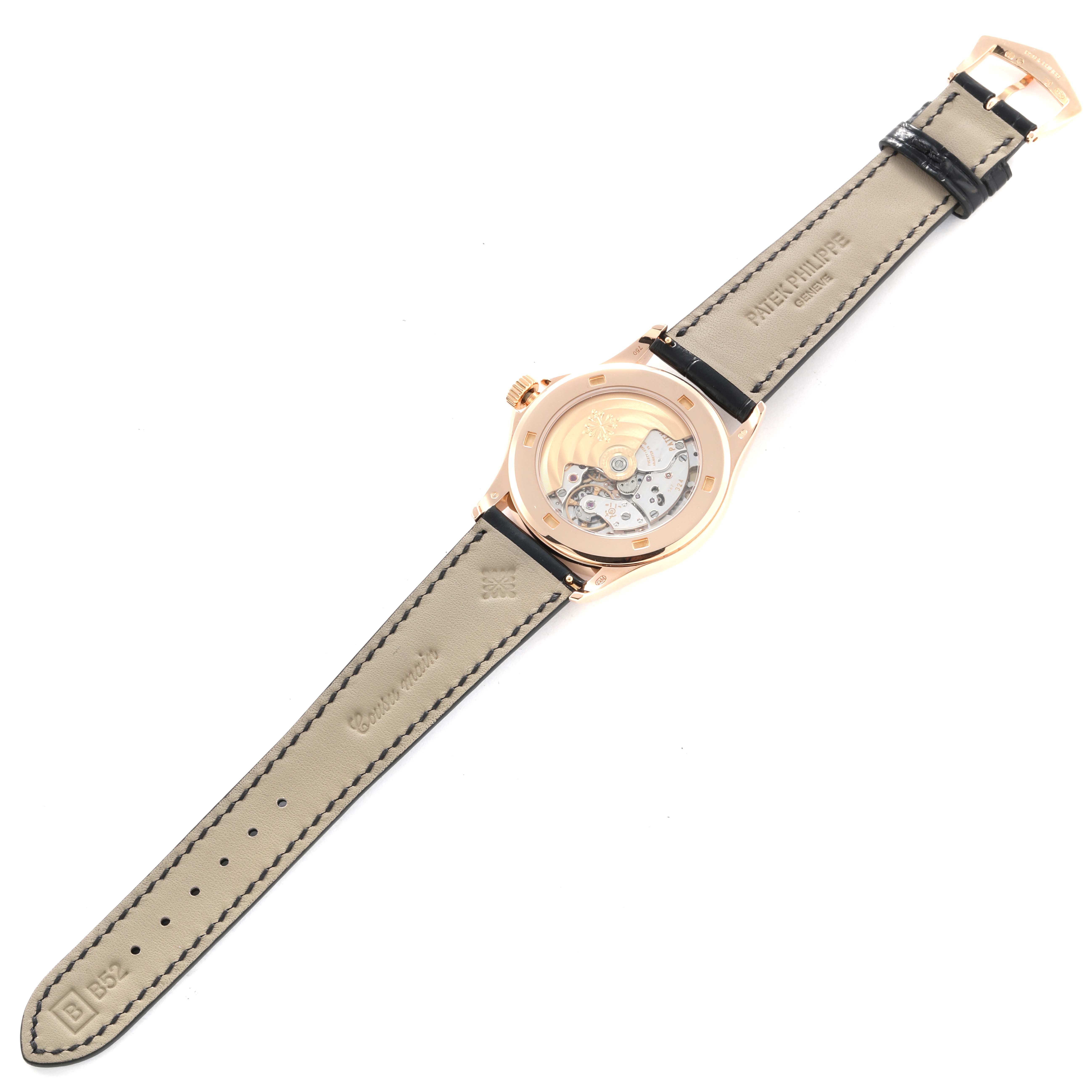 The image shows the reverse side of a Patek Philippe Calatrava 5127R Men
s Rose Gold Silver Dial, highlighting the movement and leather strap.