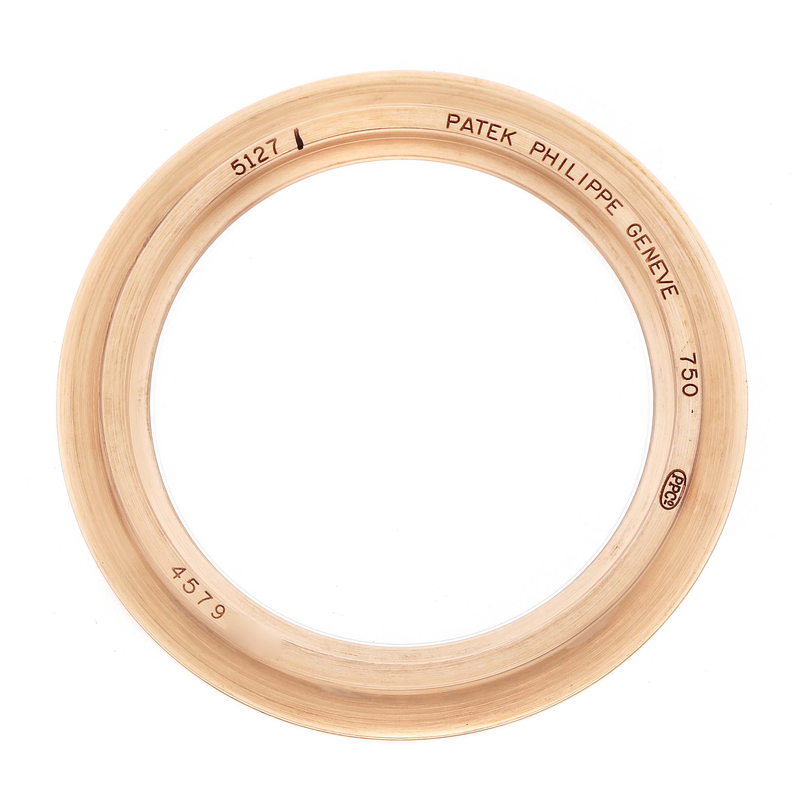 The image shows the bezel of a Patek Philippe Calatrava 5127R Men
s Rose Gold Silver Dial model, viewed from a top-down angle.