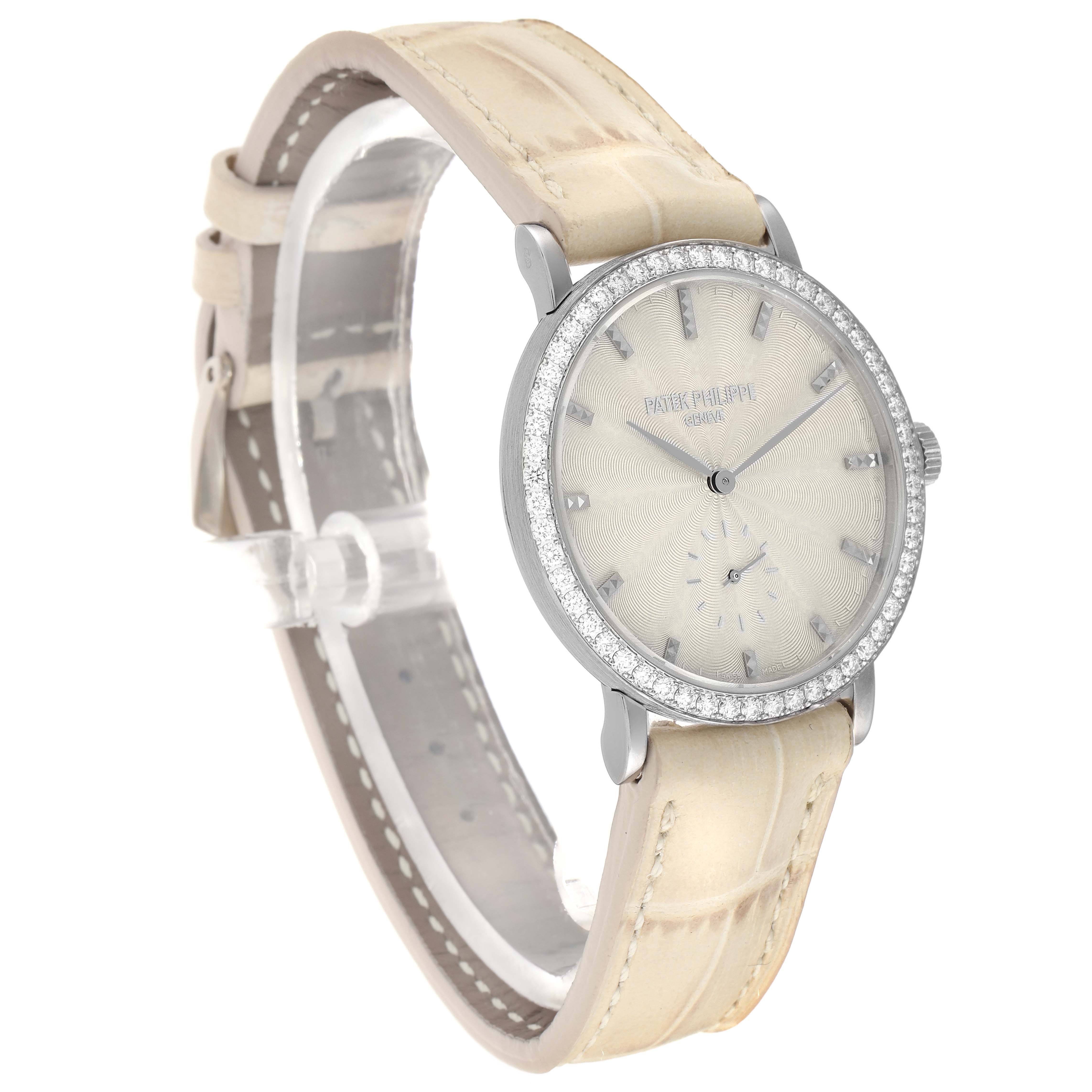 The image shows a side view of the Patek Philippe Calatrava 7120 Women
s White Gold Beige Dial watch, highlighting the face, bezel, and leather strap.