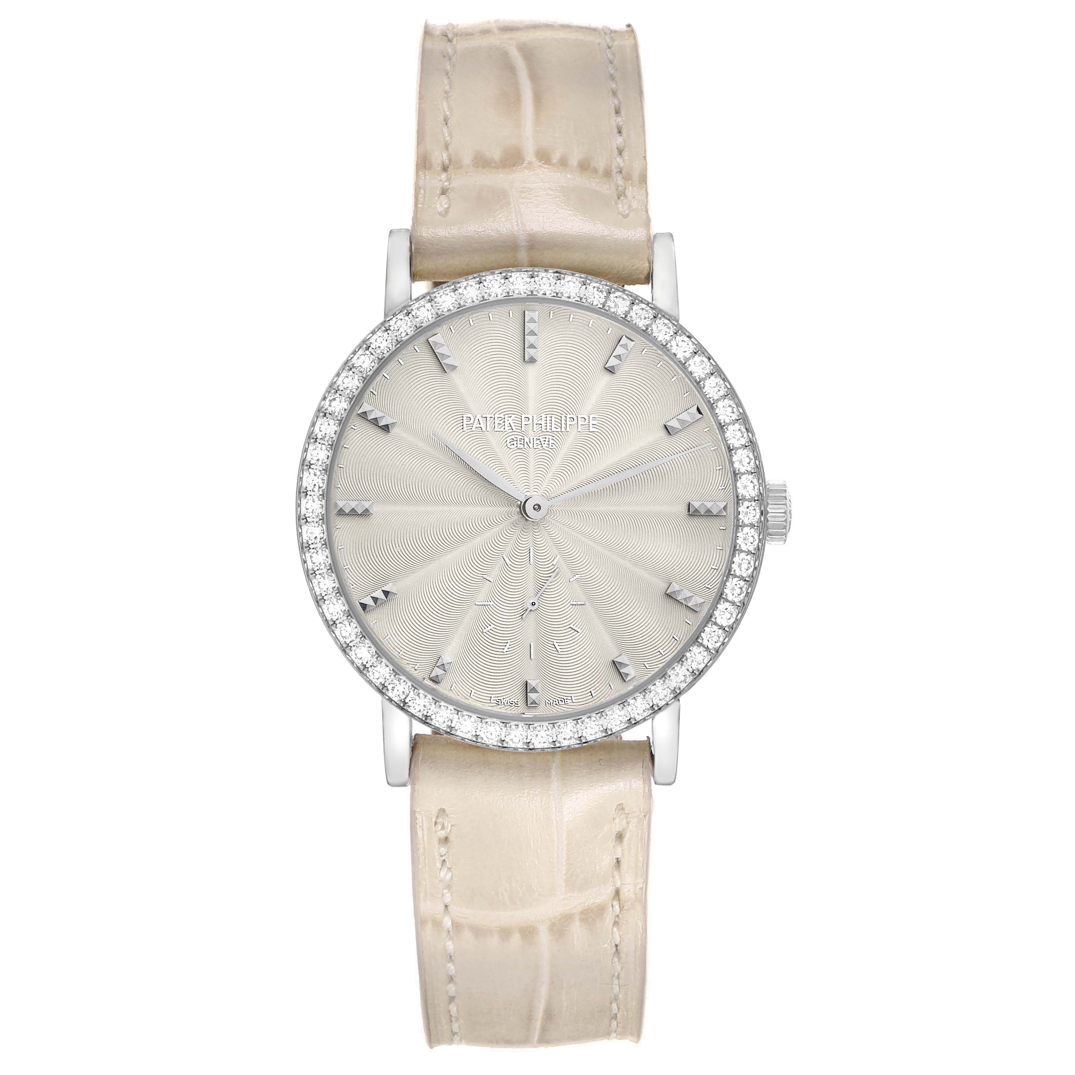 The Patek Philippe Calatrava 7120 Women's White Gold Beige Dial watch is shown from the front, featuring a diamond bezel, textured dial, and beige leather strap.