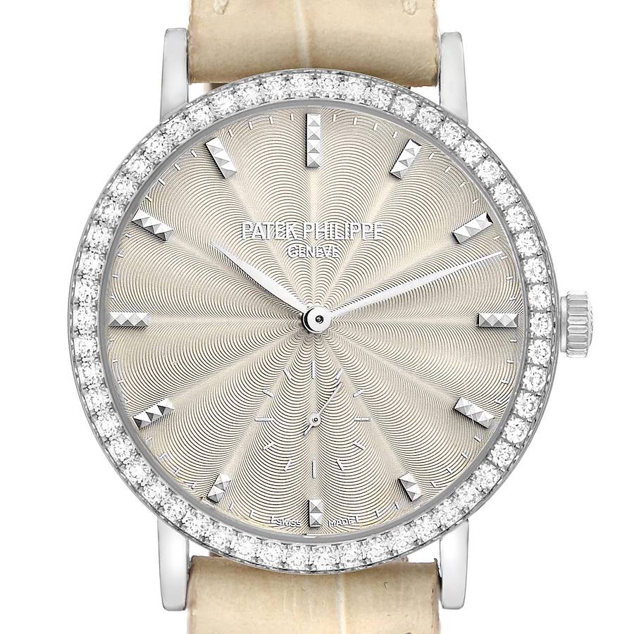 The Patek Philippe Calatrava 7120 Women's White Gold Beige Dial watch is shown from the front, highlighting its intricate dial, diamond bezel, and crown.