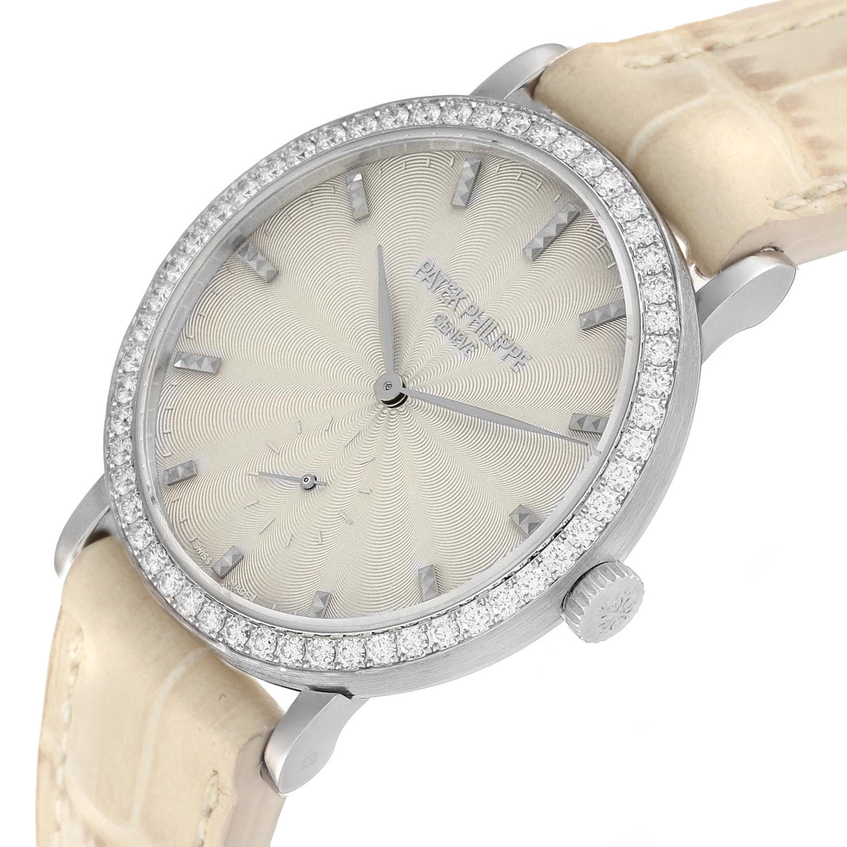 The Patek Philippe Calatrava 7120 Women
s White Gold Beige Dial watch is shown from a front angle, highlighting the bezel, dial, hands, and strap.