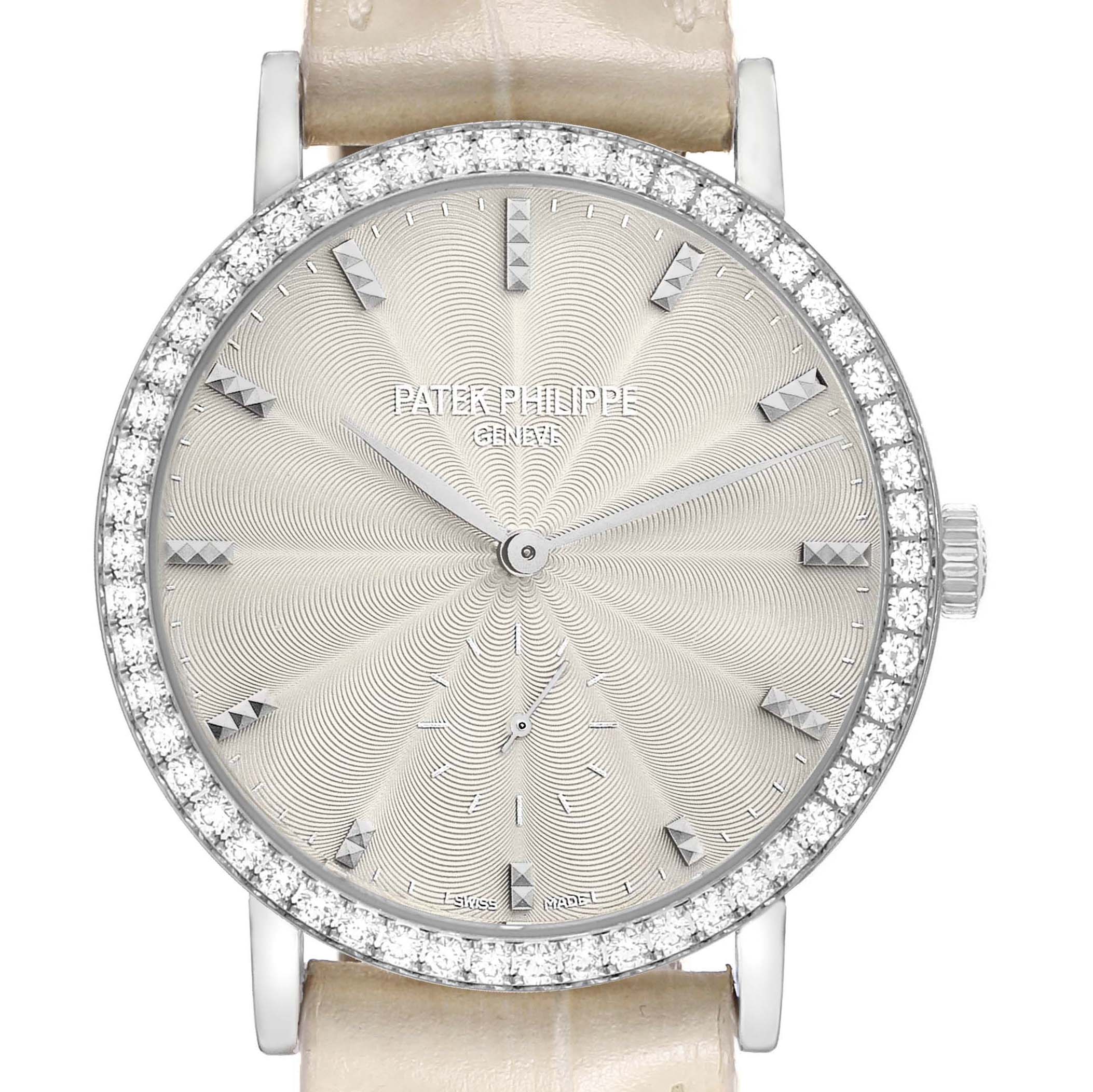 The image shows a frontal view of a Patek Philippe Calatrava 7120 Women's White Gold Beige Dial watch with a decorated dial and diamond-set bezel.