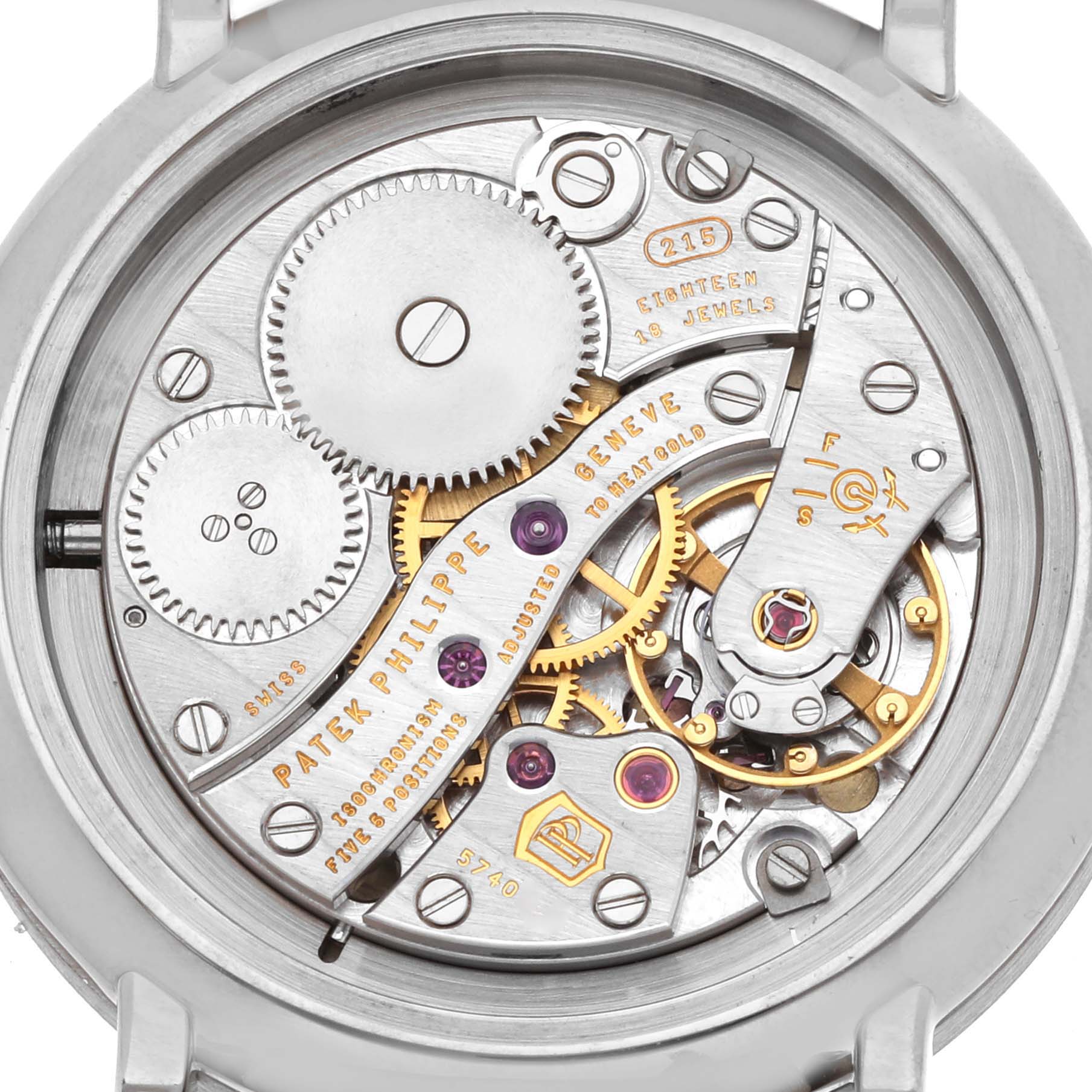 This image shows the back view of a Patek Philippe Calatrava 7120 Women
s White Gold Beige Dial watch, highlighting its intricate movement and gears.