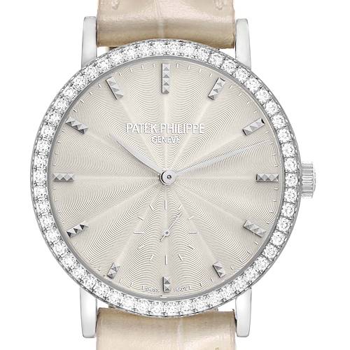The Patek Philippe Calatrava 7120 Women's White Gold Beige Dial watch is shown from the front, highlighting its detailed dial, diamond bezel, and crown.