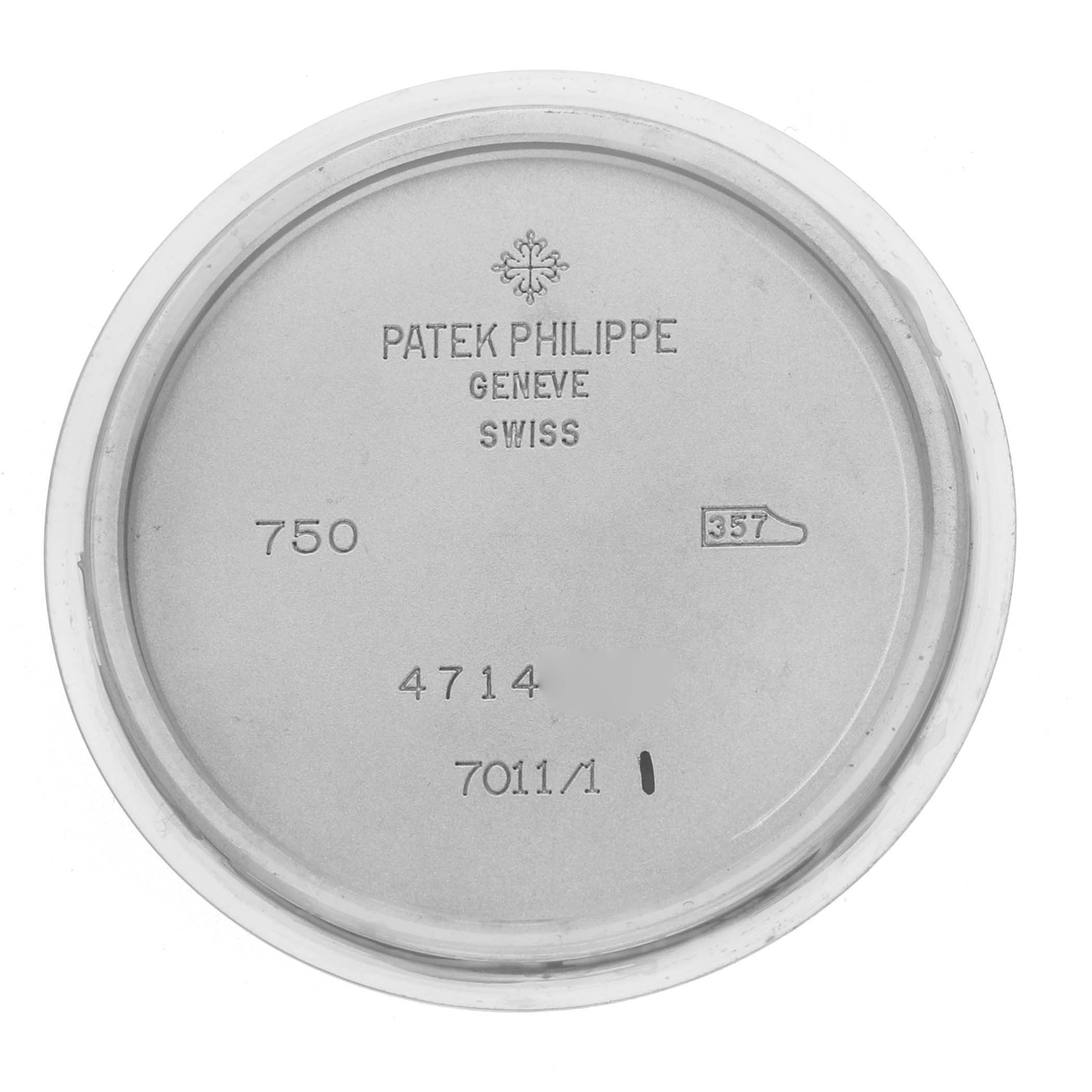 This image shows the inner case back of a Patek Philippe Nautilus 7011G Women
s White Gold Silver Dial watch with engraved model details.