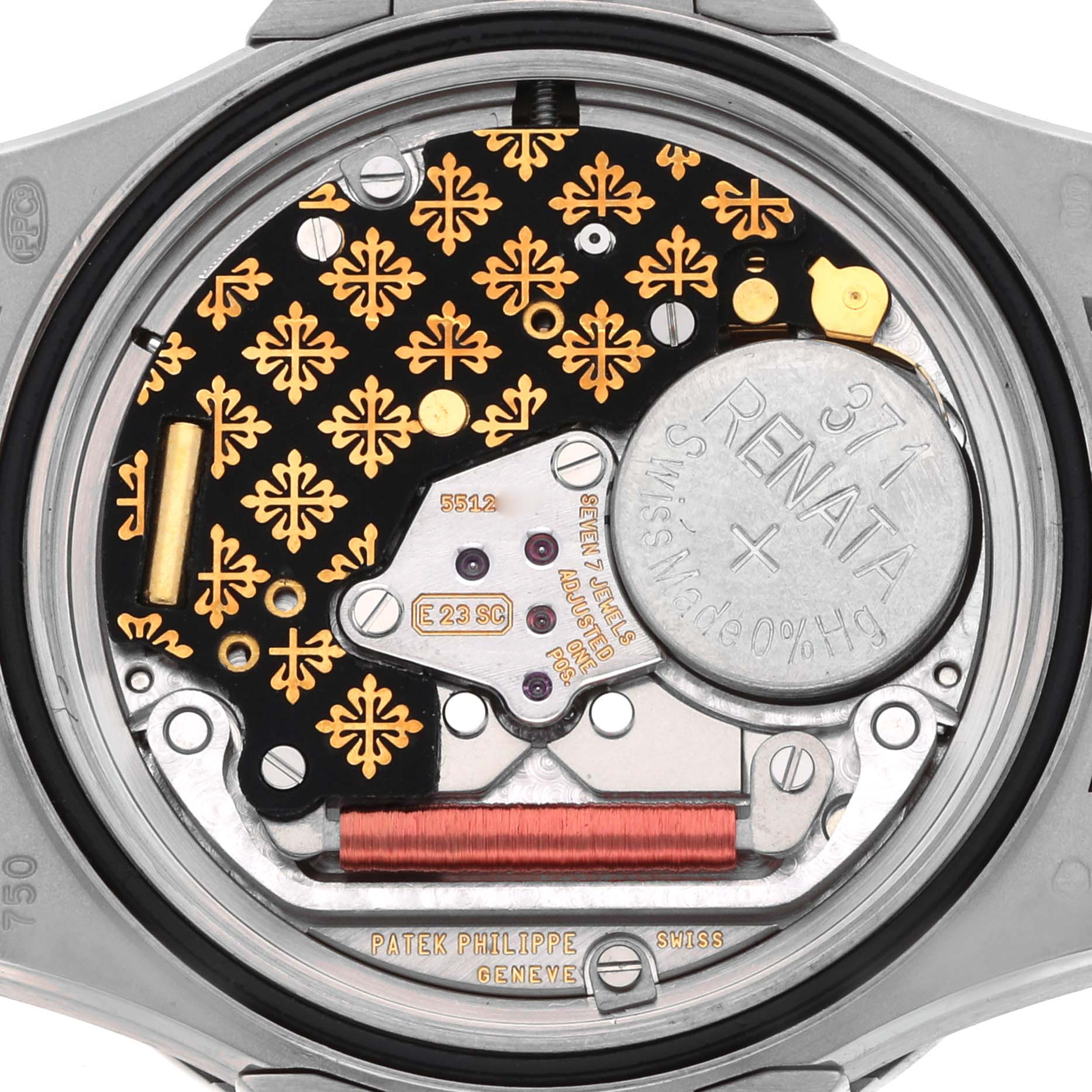 The image shows the back of a Patek Philippe Nautilus 7011G Women
s White Gold Silver Dial, highlighting the intricate movement and battery compartment.