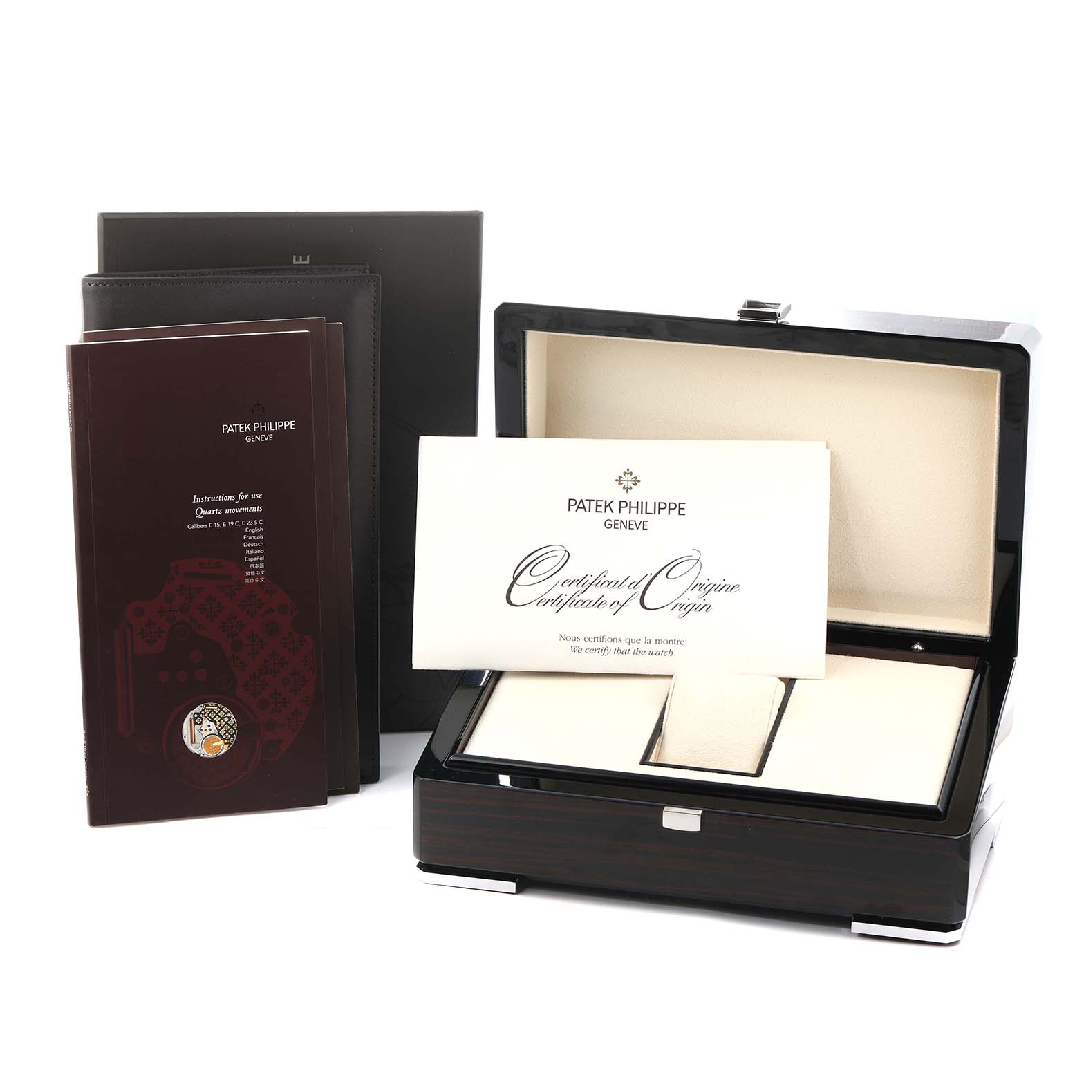 The image shows a Patek Philippe Nautilus 7011G Women
s White Gold Silver Dial watch box and accessories, including a certificate and instruction booklet.