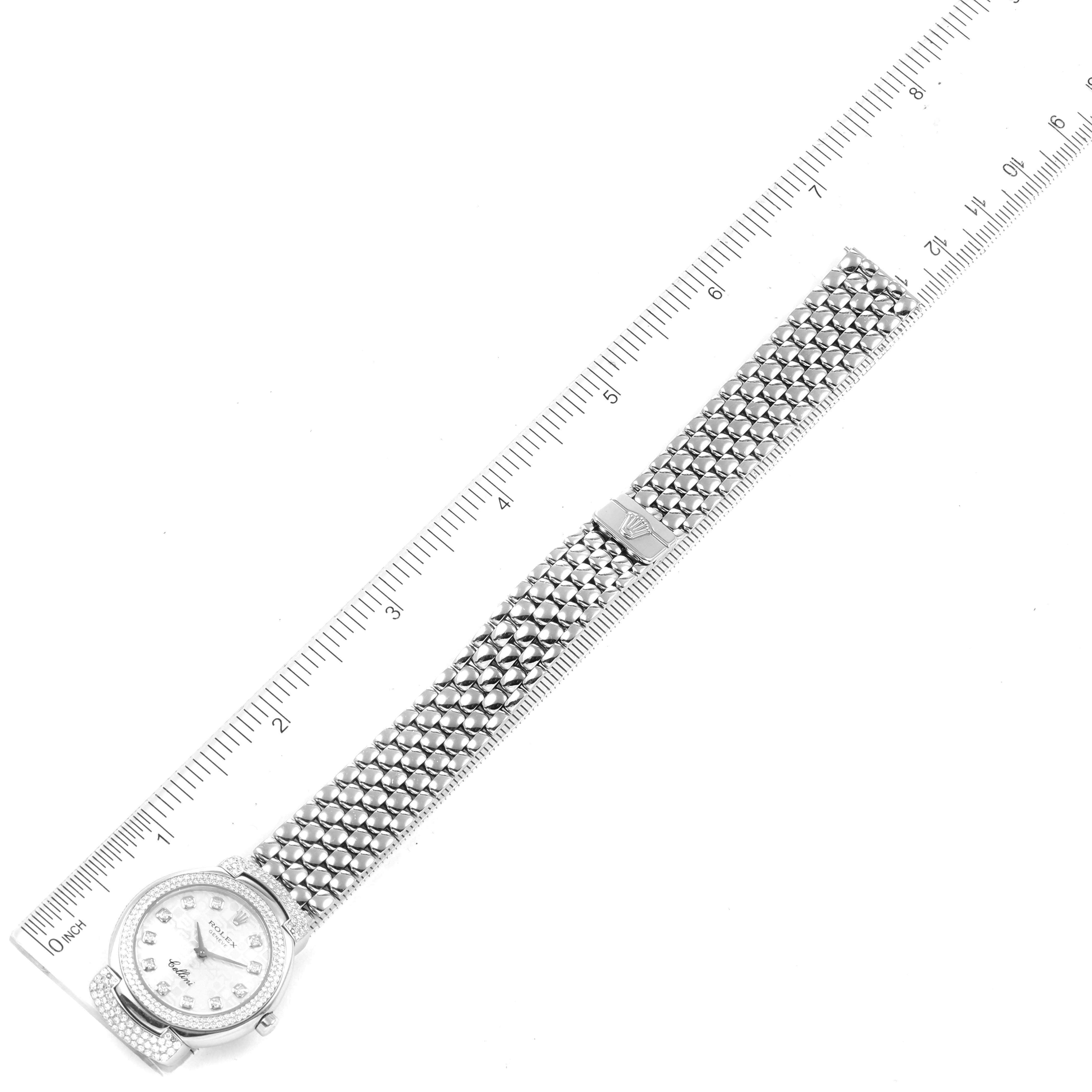 The Rolex Cellini 6673 Women's White Gold Silver Dial 6673 Women's White Gold Silver Dial watch is shown from a top-down angle, featuring the face, bracelet, and a ruler for size reference.