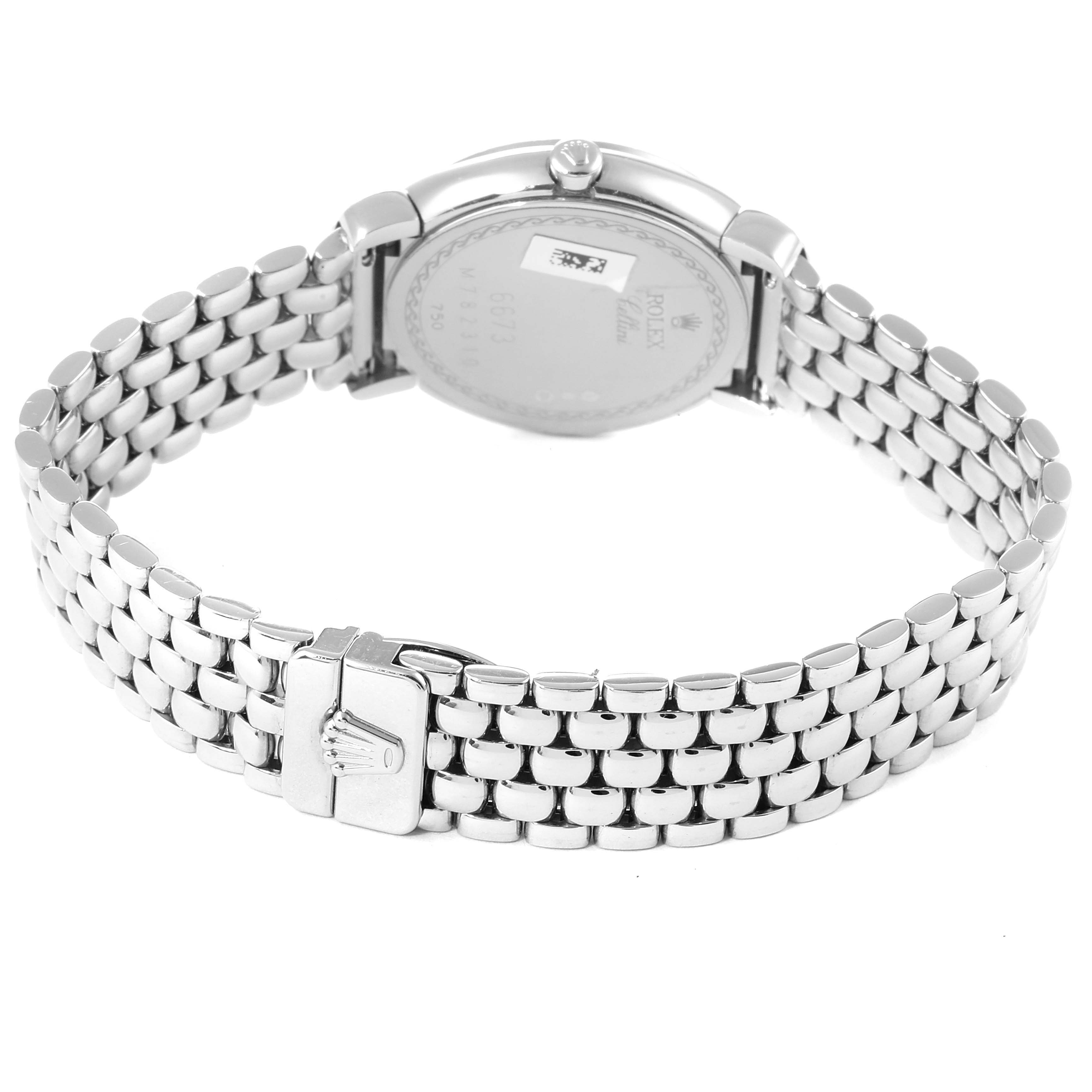 This image shows the back view of a Rolex Cellini 6673 Women's White Gold Silver Dial 6673 Women's White Gold Silver Dial watch, focusing on its case back and metal bracelet with clasp.