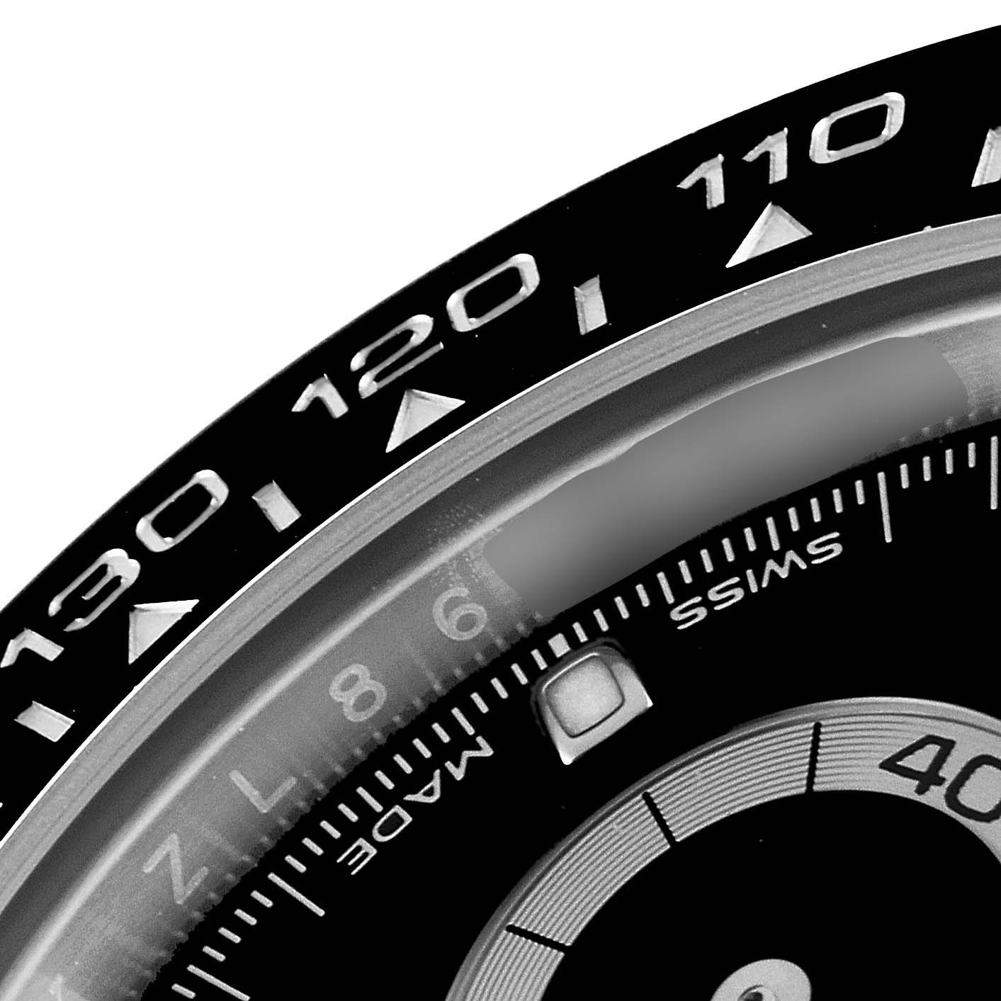 This is a close-up of the dial and bezel of the Rolex Daytona 116500 Men's Stainless Steel Black Dial 116500 Men's Stainless Steel Black Dial watch, focusing on the tachymeter scale.