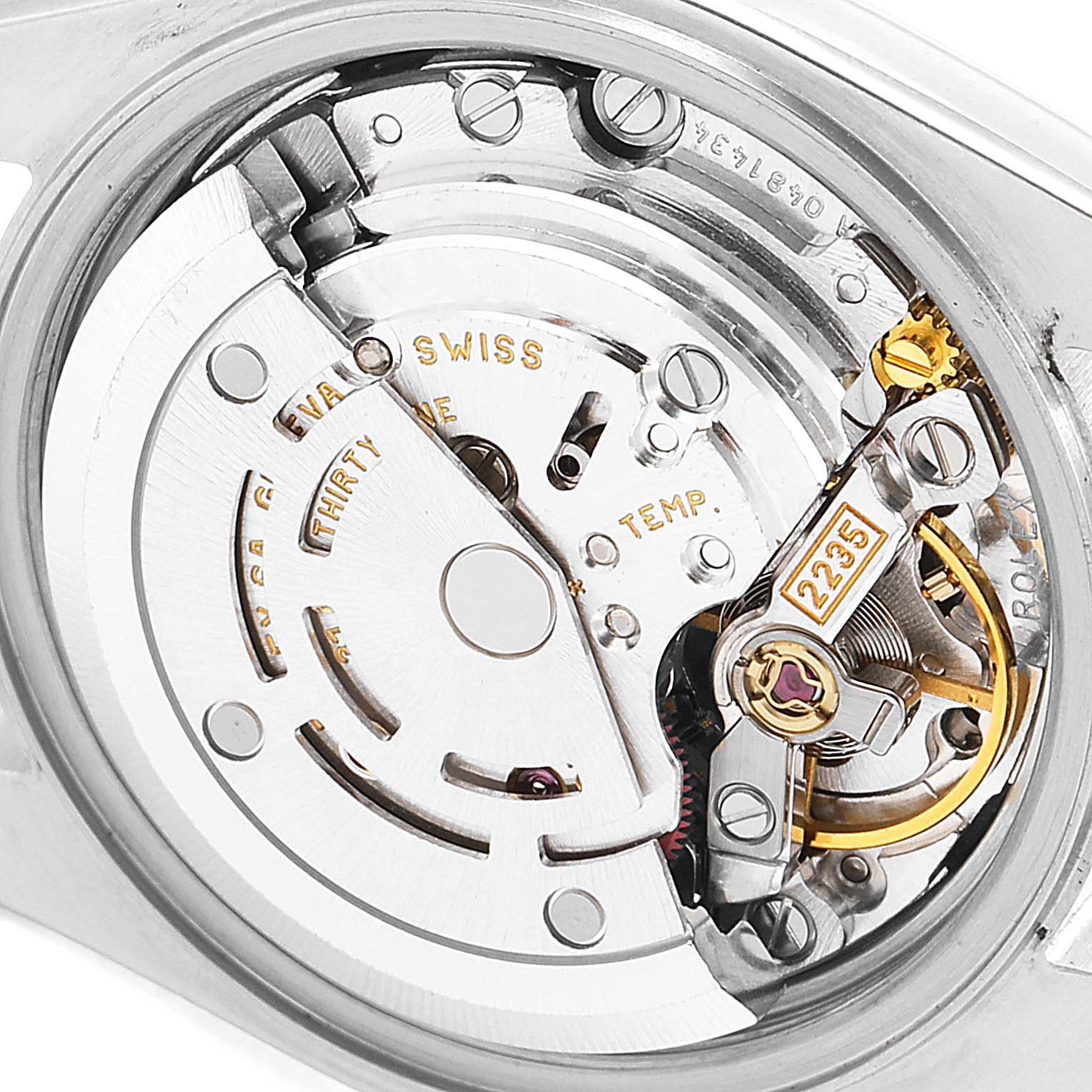 This image shows a close-up of the movement mechanism inside a Rolex Date 79240 Women's Stainless Steel Black Dial 79240 Women's Stainless Steel Black Dial model watch, highlighting the internal components.