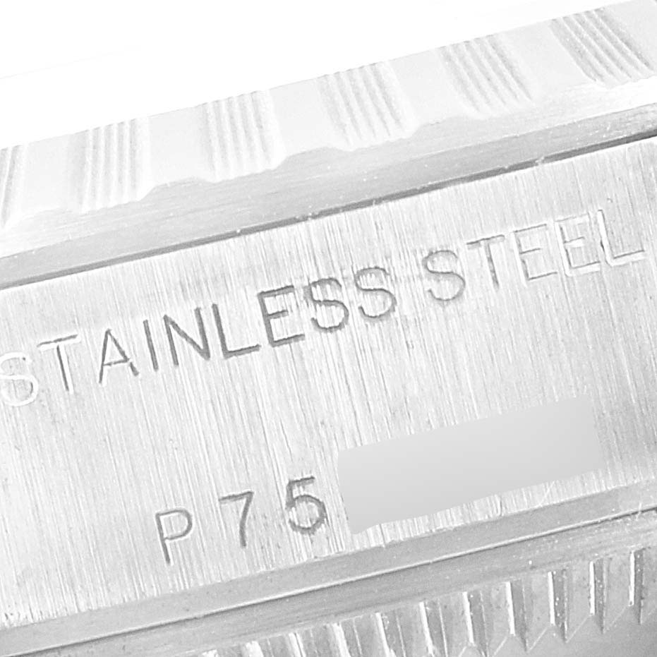 The image shows a close-up of the stainless steel and part of the bezel of a Rolex Date 79240 Women's Stainless Steel Black Dial 79240 Women's Stainless Steel Black Dial model watch.