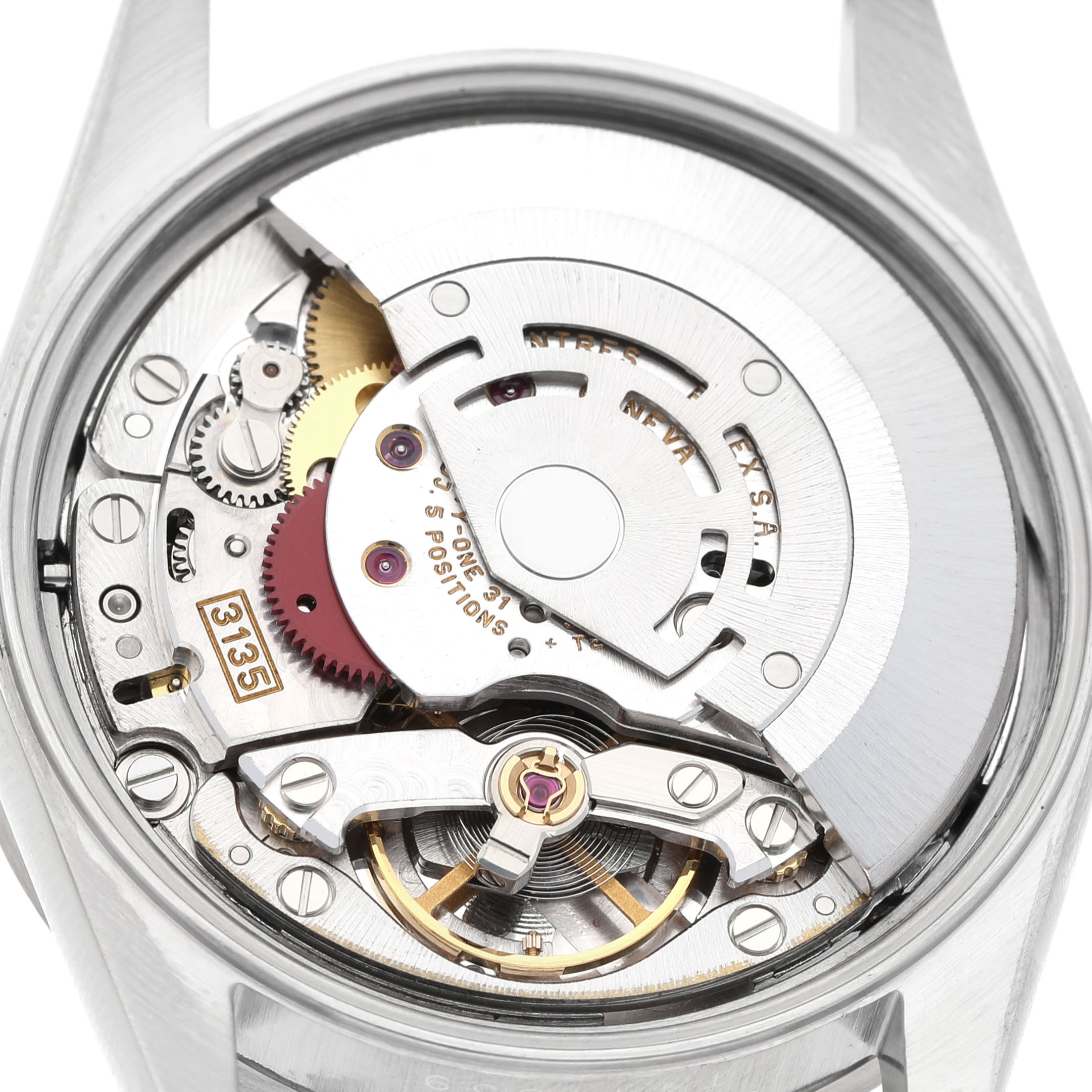 This image shows the open case back of a Rolex Date 15210 Men's Stainless Steel Blue Dial model, highlighting the intricate movement and components inside.