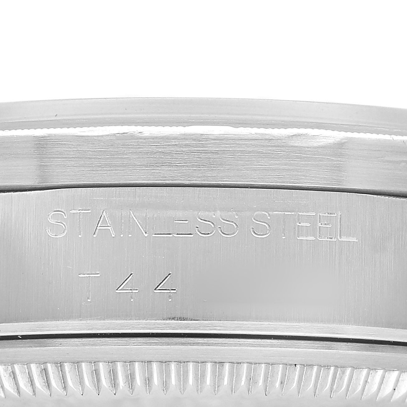 This image shows the side profile of a Rolex Date 15210 Men's Stainless Steel Blue Dial model, focusing on the engraved stainless steel case back.