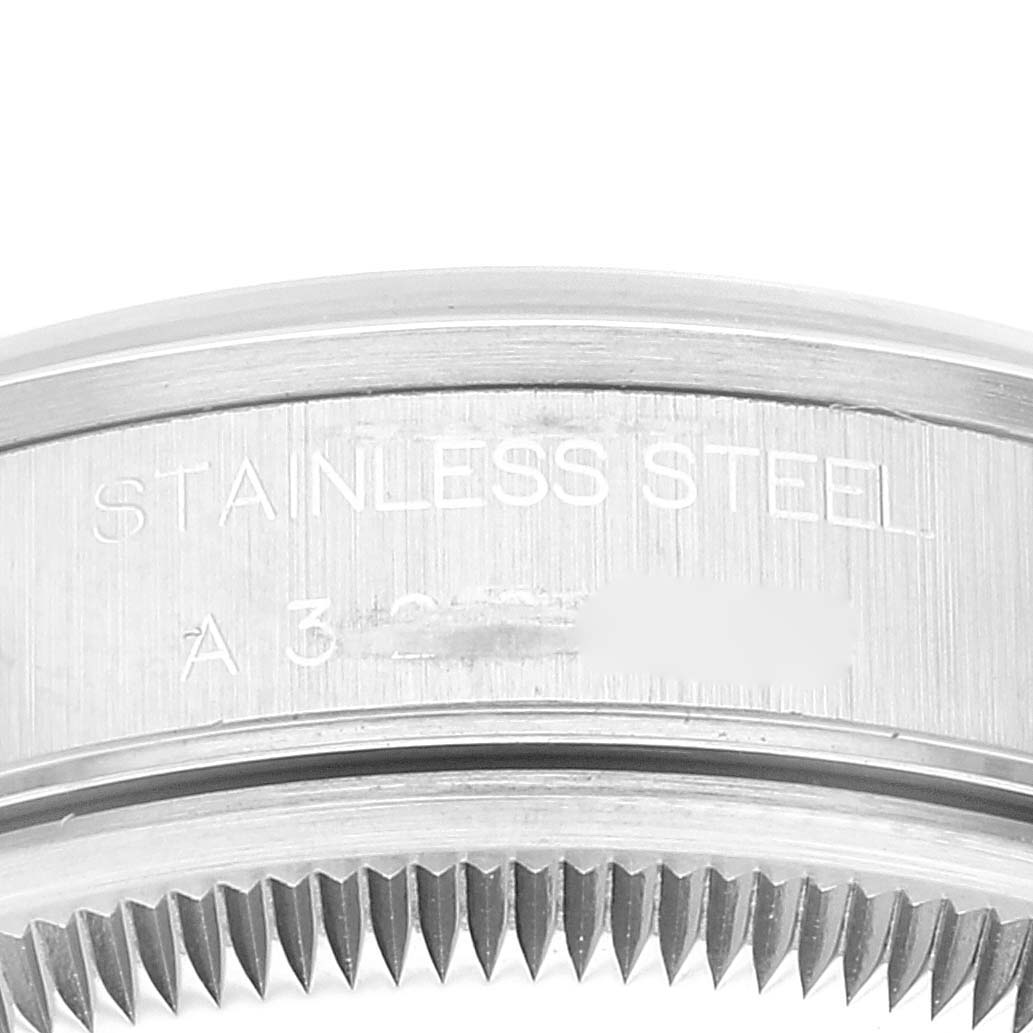 The image shows a close-up of the stainless steel bezel of a Rolex Date 15200 Men's Stainless Steel White Dial 15200 Men's Stainless Steel White Dial model watch.