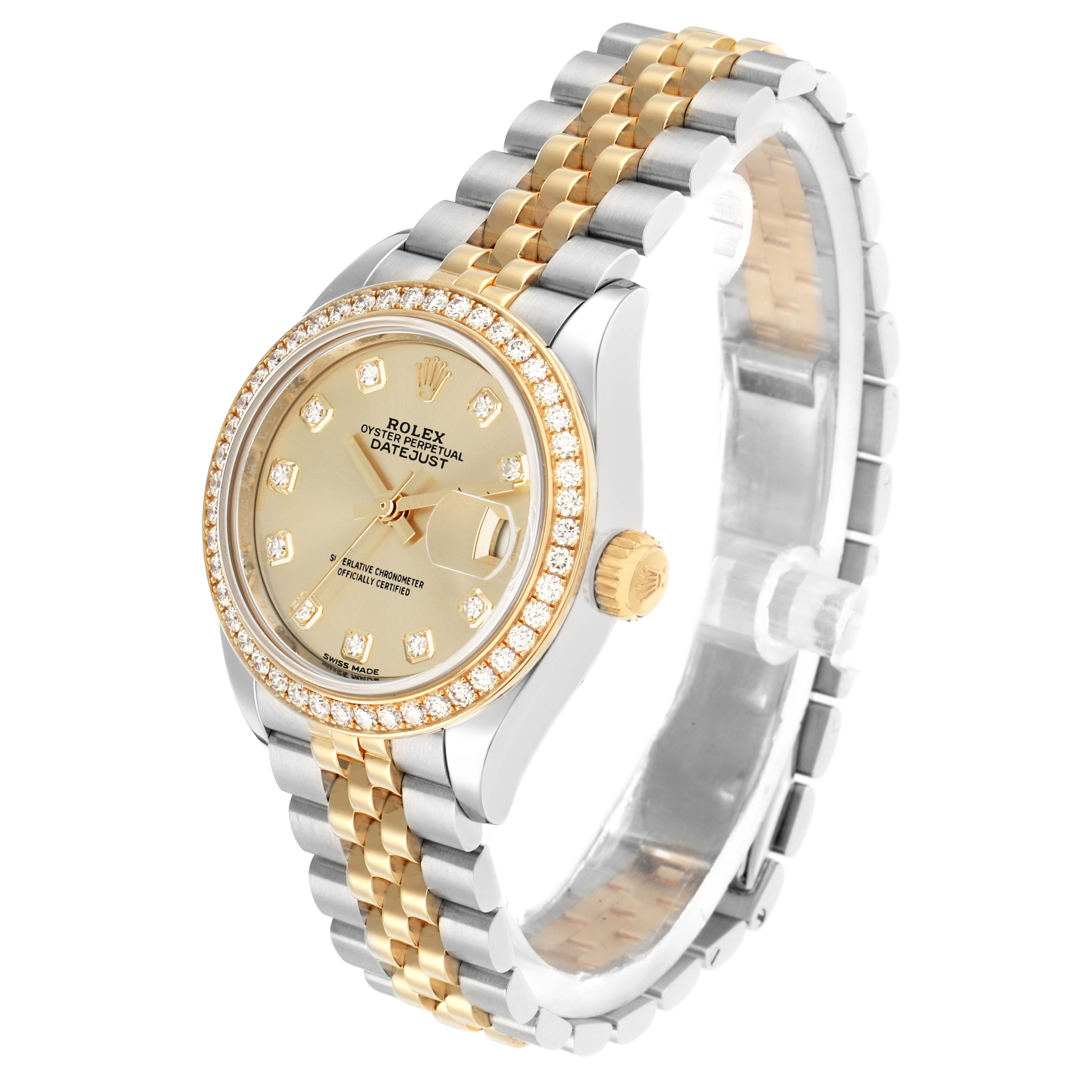 The Rolex Datejust 279383 Women
s Steel and Gold (two tone) Champagne Dial watch is shown at an angled side view, highlighting the dial, bezel, and two-tone Jubilee bracelet.