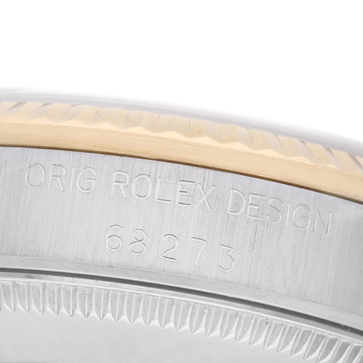The image shows a close-up of a Rolex Mid-Size 68273 Women
s Steel and Gold (two tone) White Dial watch case side, highlighting the model number and design engraving.