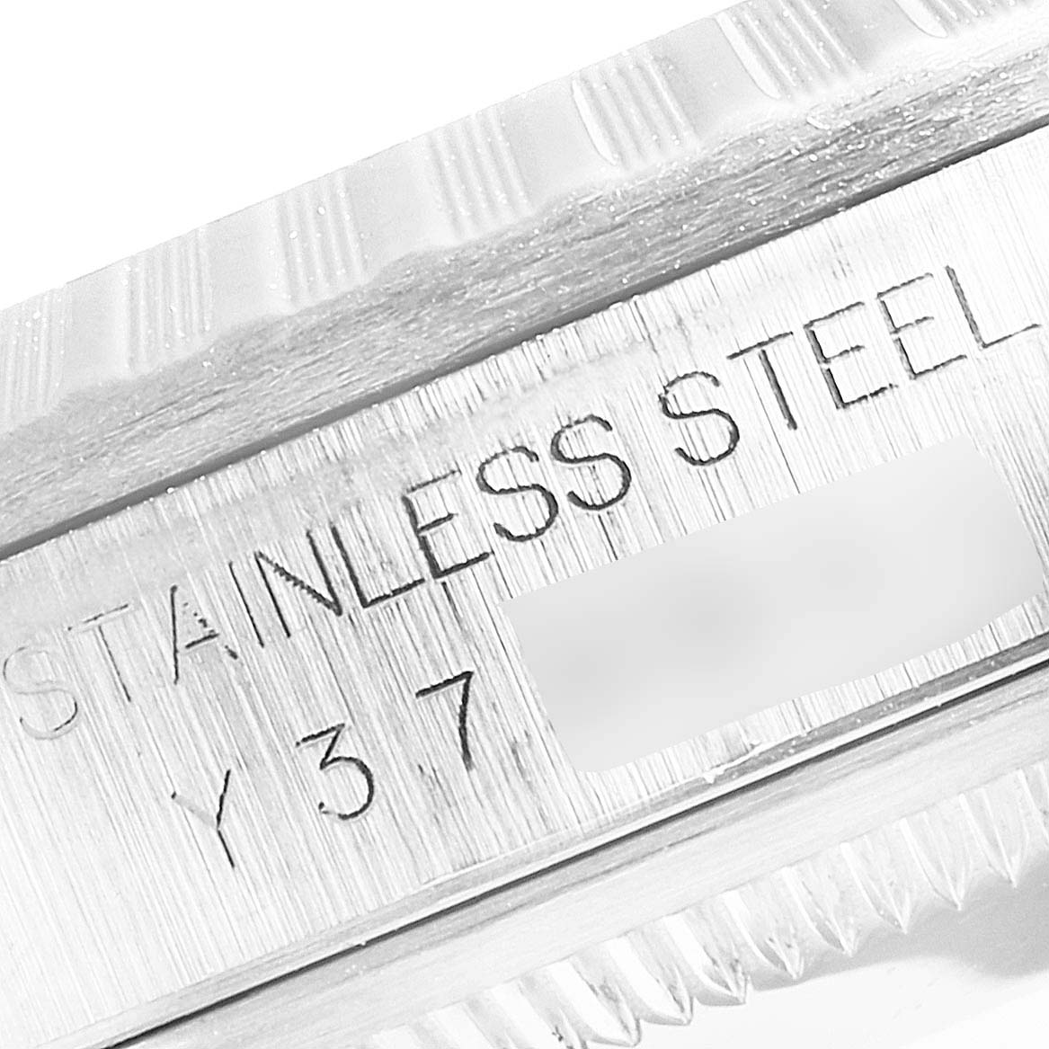 The image shows a close-up of the stainless steel case and fluted bezel of the Rolex Datejust 16220 Men
s Stainless Steel Blue Dial 16220 Men
s Stainless Steel Blue Dial watch.