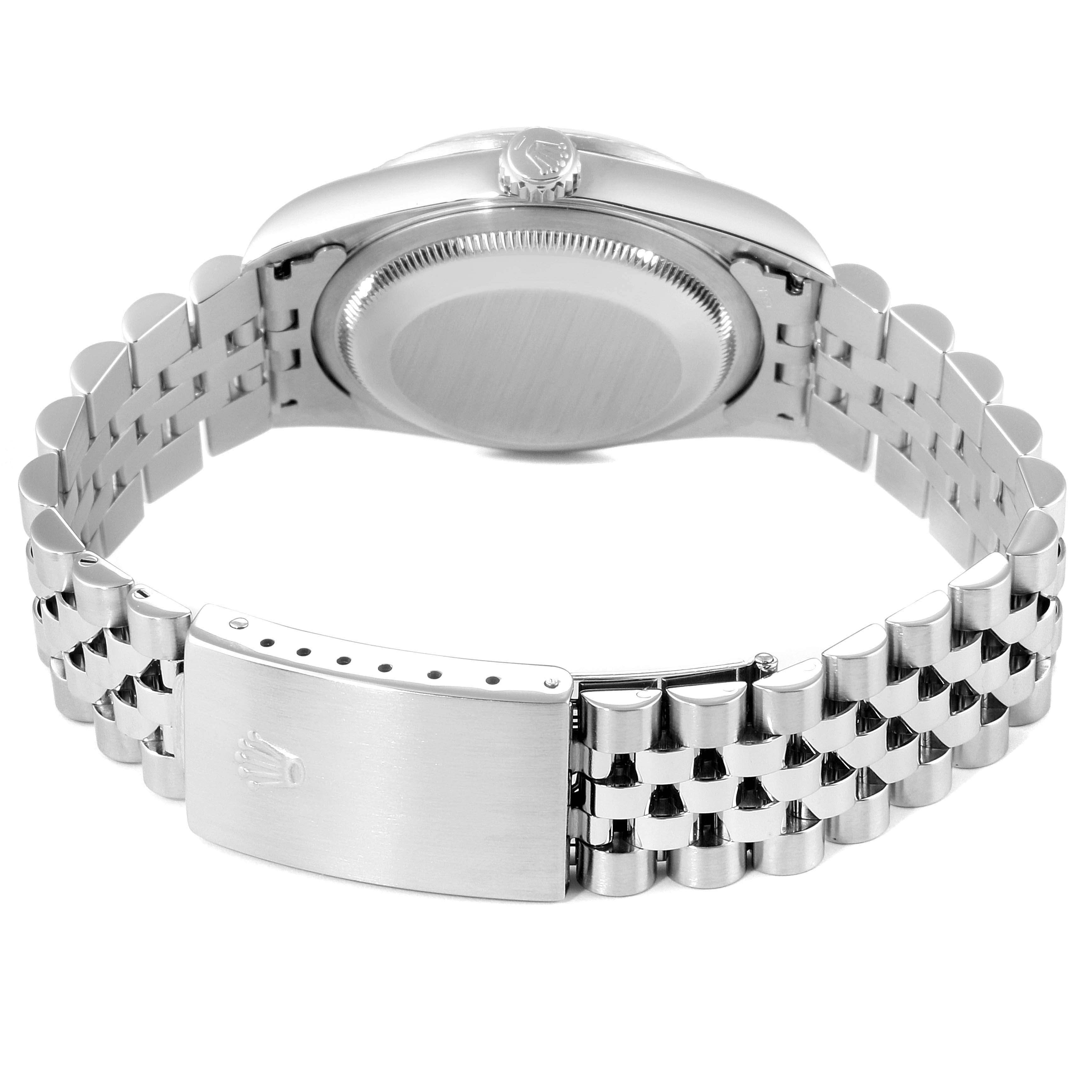 The image shows the backside of a Rolex Datejust 16220 Men
s Stainless Steel Blue Dial 16220 Men
s Stainless Steel Blue Dial watch, highlighting the case back, crown, and bracelet clasp.