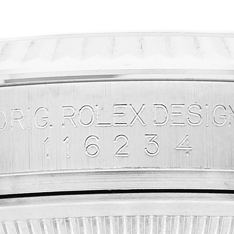 This close-up image shows the engraved serial number on the case side of a Rolex Datejust 116234 Men's Stainless Steel Mother of Pearl Dial 116234 Men's Stainless Steel Mother of Pearl Dial watch.