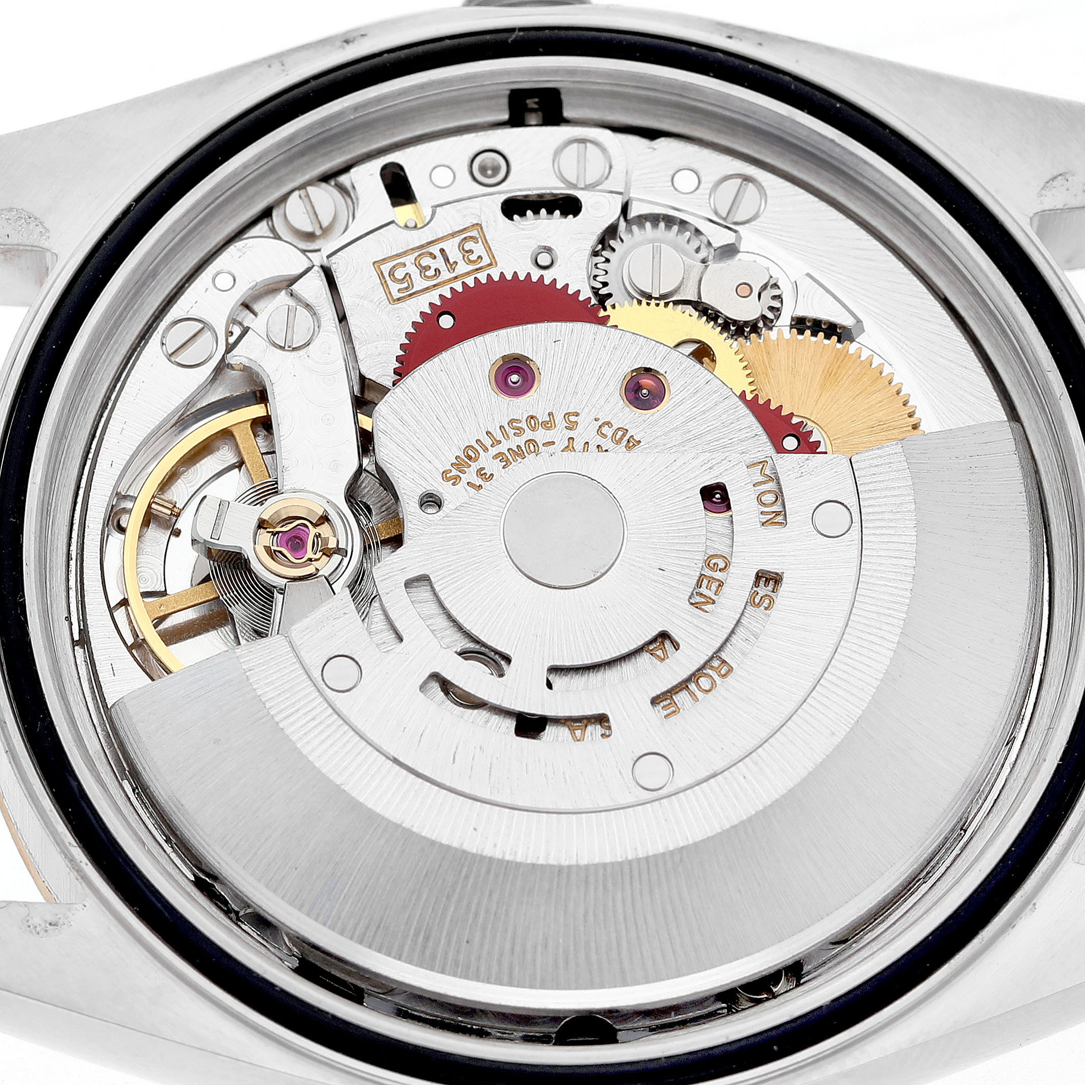 The image shows the movement of a Rolex Datejust 16233 Men's Steel and Gold (two tone) Champagne Dial watch from a rear angle, displaying its intricate gears and components.